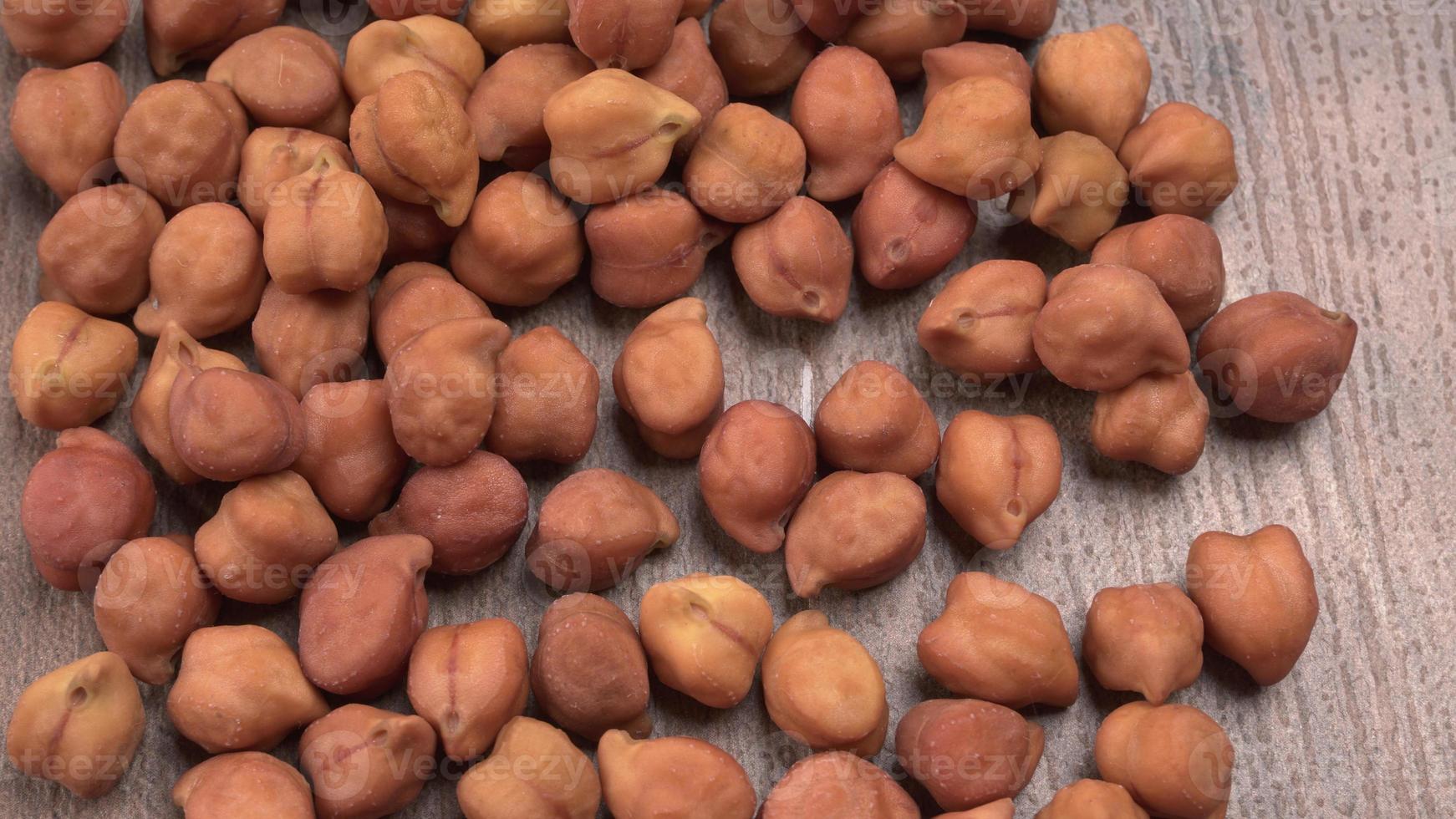 Black Chickpeas or Kala Chana with chana dal pulse isolated on wooden Background. photo