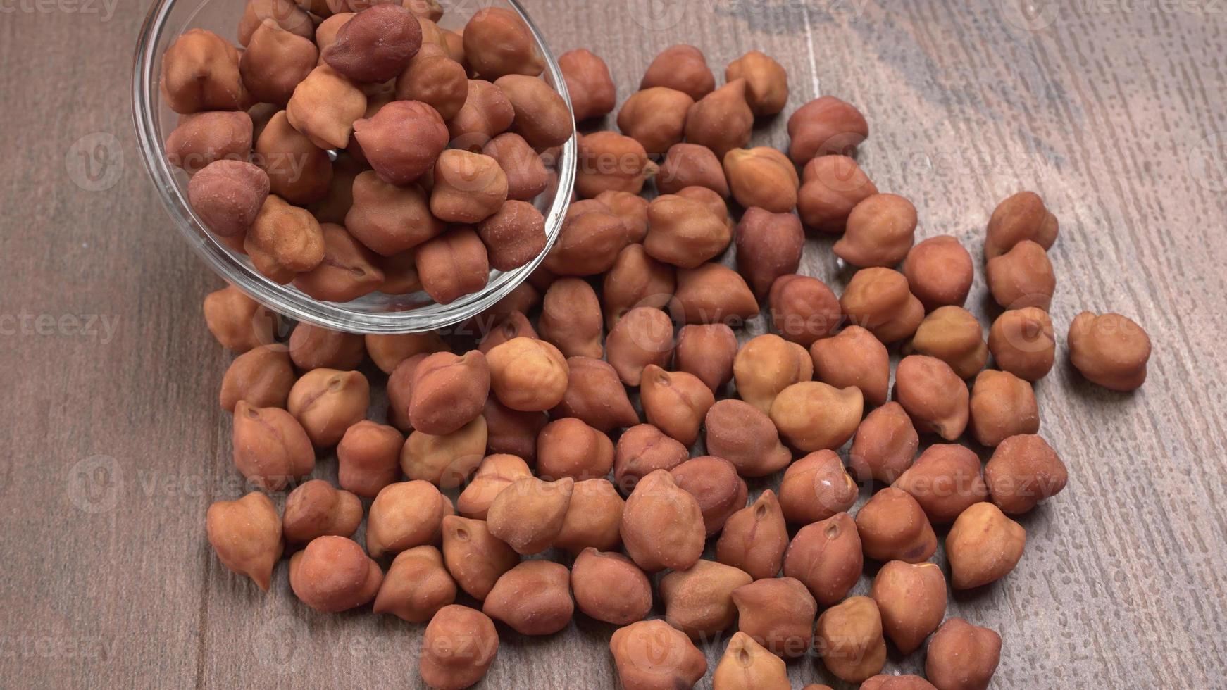 Black Chickpeas or Kala Chana with chana dal pulse isolated on wooden Background. photo