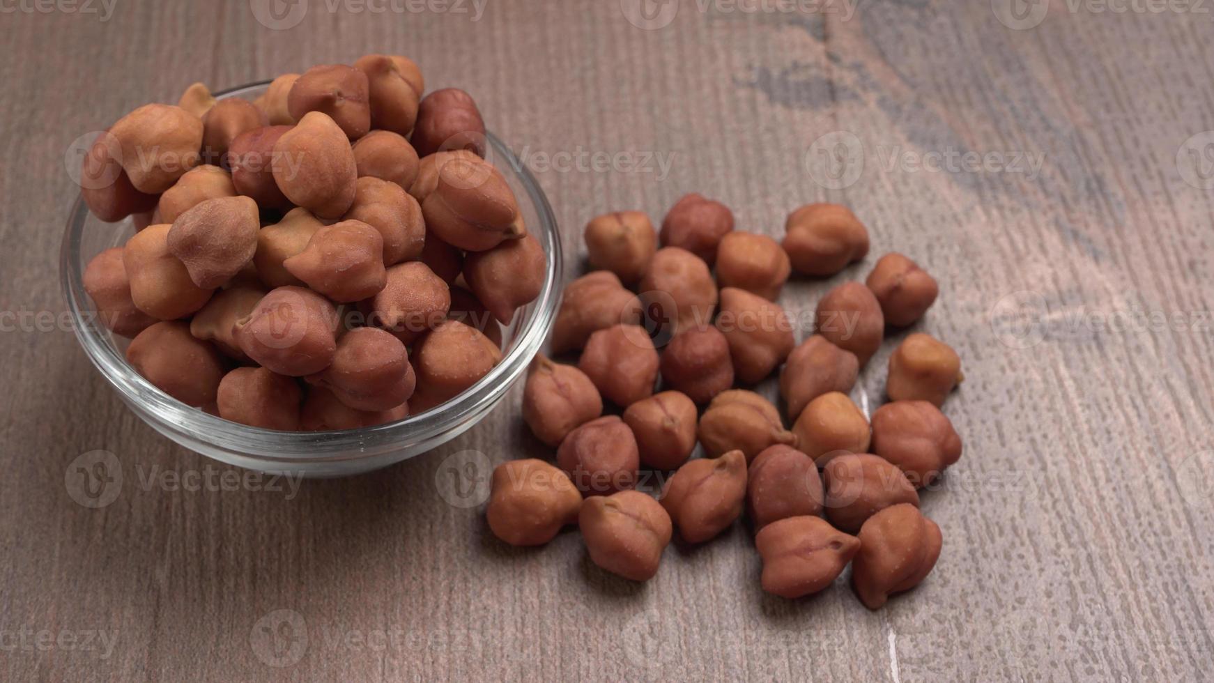 Black Chickpeas or Kala Chana with chana dal pulse isolated on wooden Background. photo