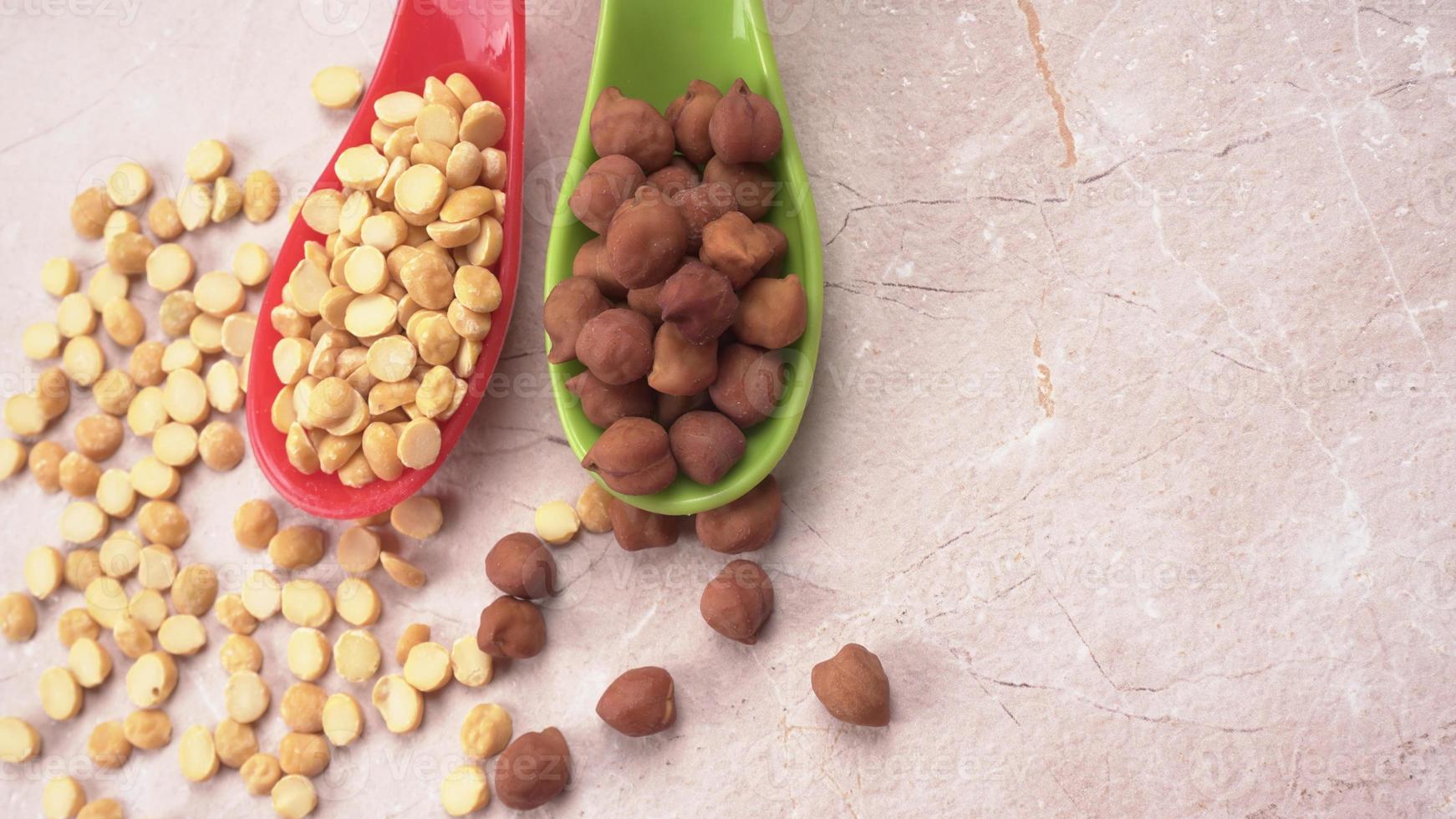 Black Chickpeas or Kala Chana with chana dal pulse isolated on wooden Background. photo