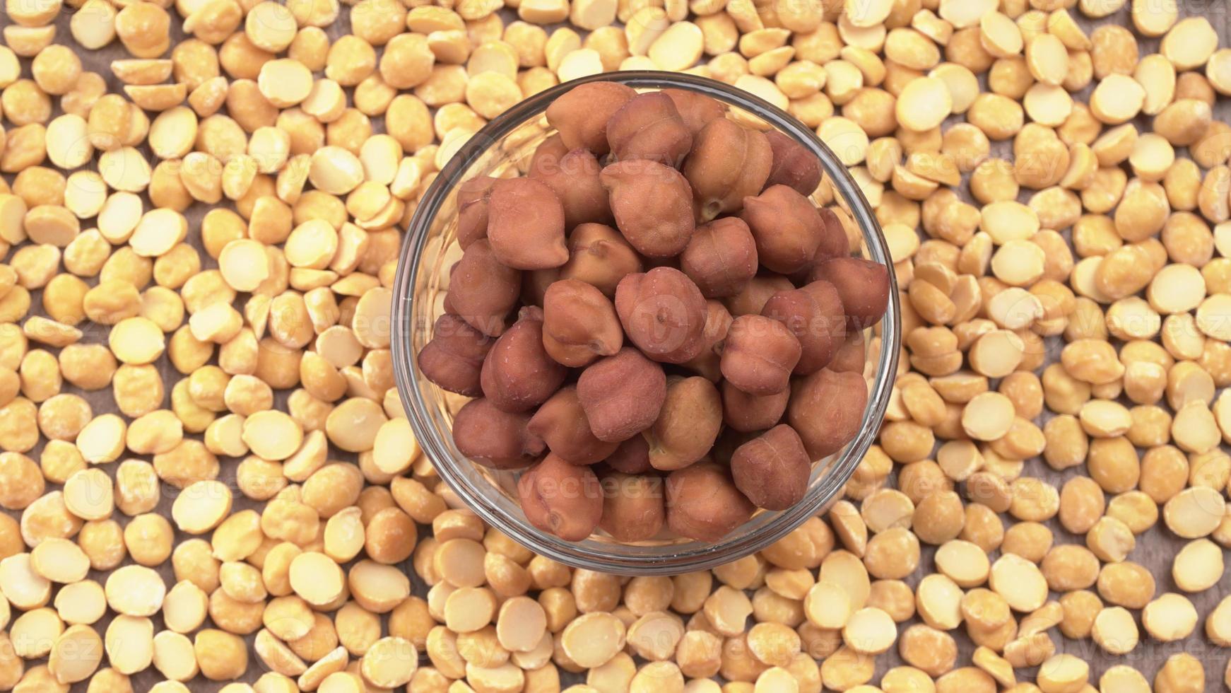 Black Chickpeas or Kala Chana with chana dal pulse isolated on wooden Background. photo