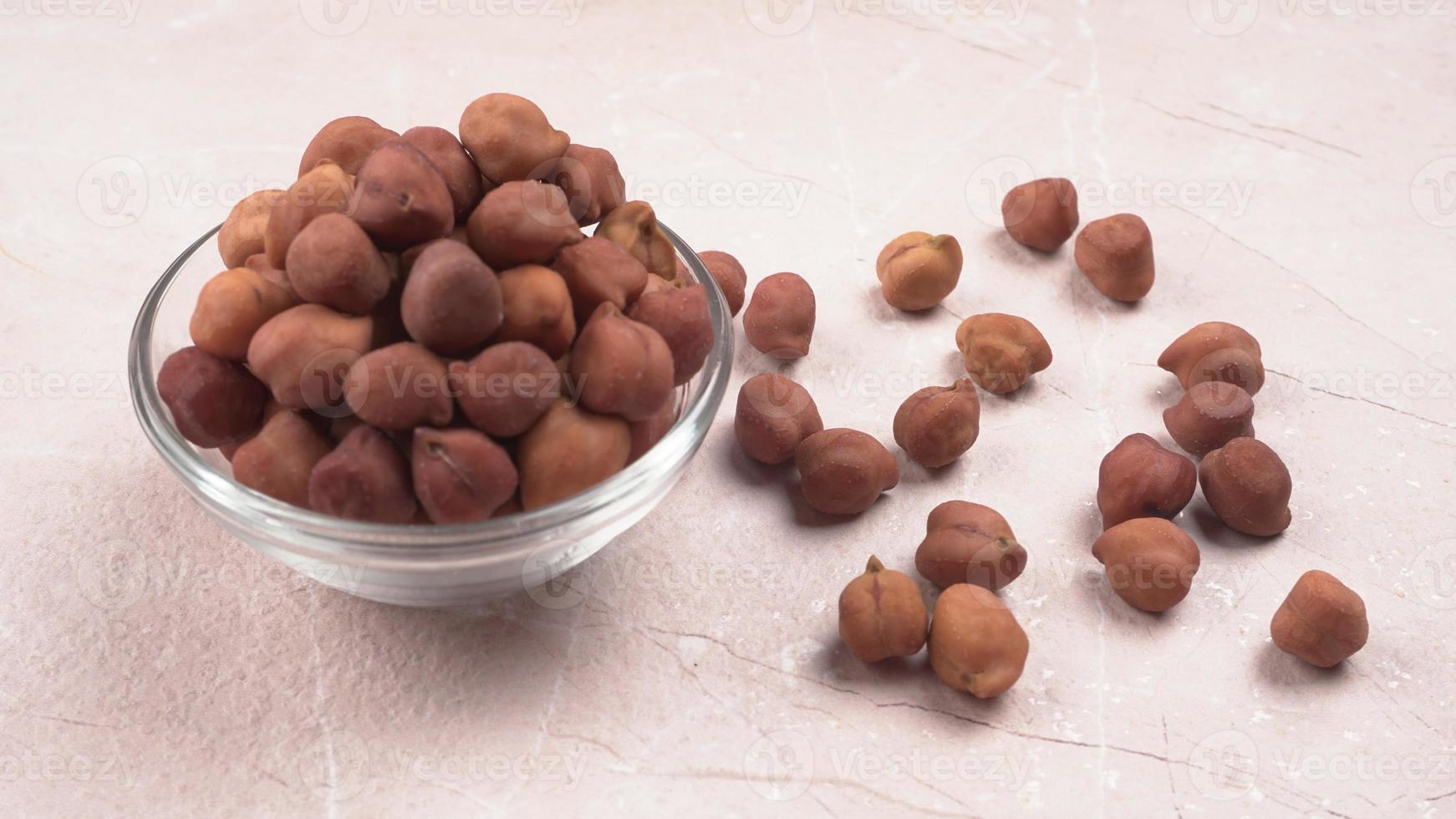Black Chickpeas or Kala Chana with chana dal pulse isolated on wooden Background. photo