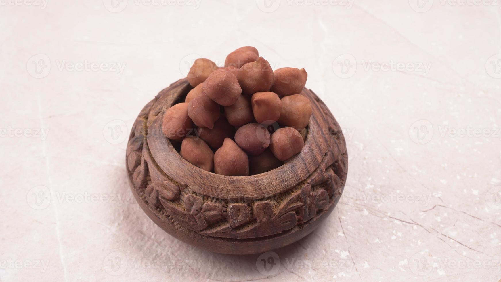 Black Chickpeas or Kala Chana with chana dal pulse isolated on wooden Background. photo