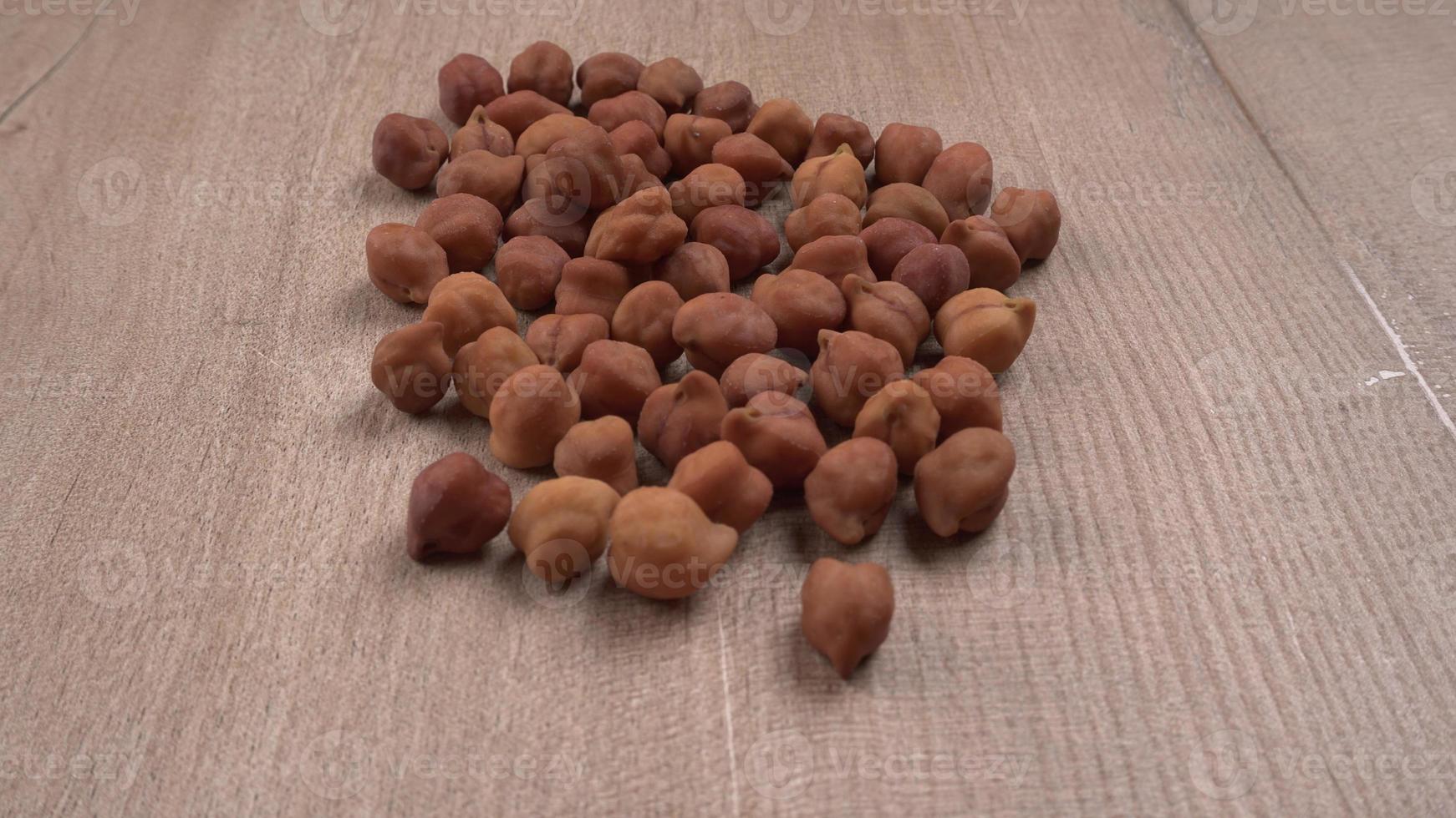 Black Chickpeas or Kala Chana with chana dal pulse isolated on wooden Background. photo