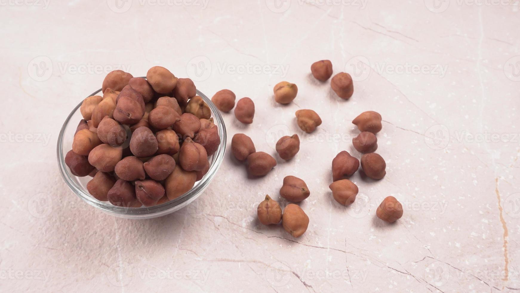 Black Chickpeas or Kala Chana with chana dal pulse isolated on wooden Background. photo