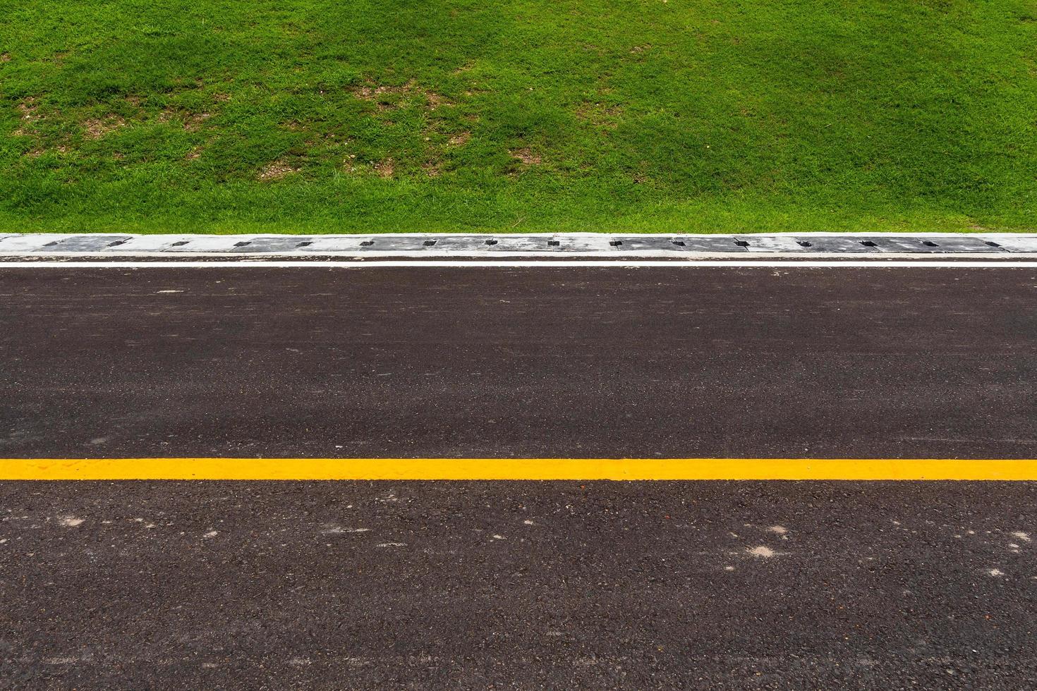 Asphalt road with marking lines white stripes texture Background photo