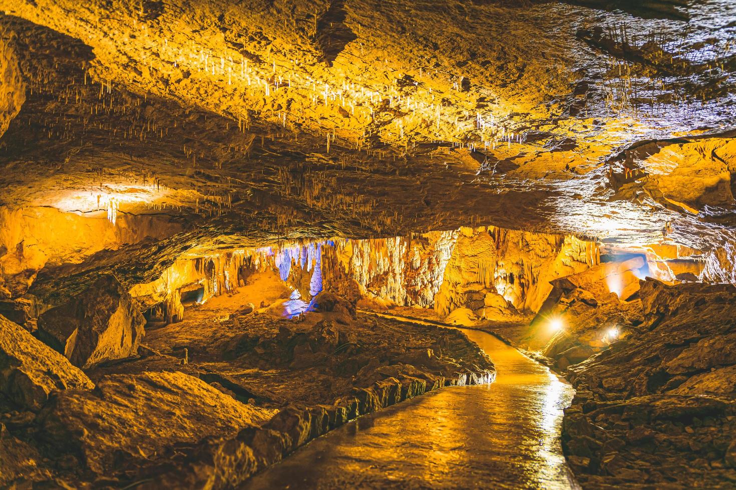 Illuminated prometheus cave and pathway with no tourist. Travel spots and sightseeing in Georgia. photo