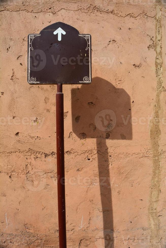 Street sign with arrow up photo