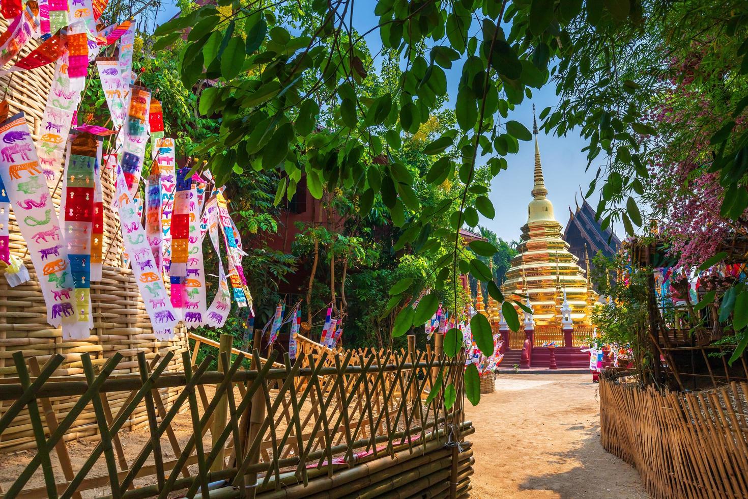 Prayer flags tung Hang with umbrella or Northern traditional flag hang on sand pagoda in the Phan Tao temple for Songkran Festival is celebrated in a traditional New Year's Day in Chiang Mai,Thailand photo