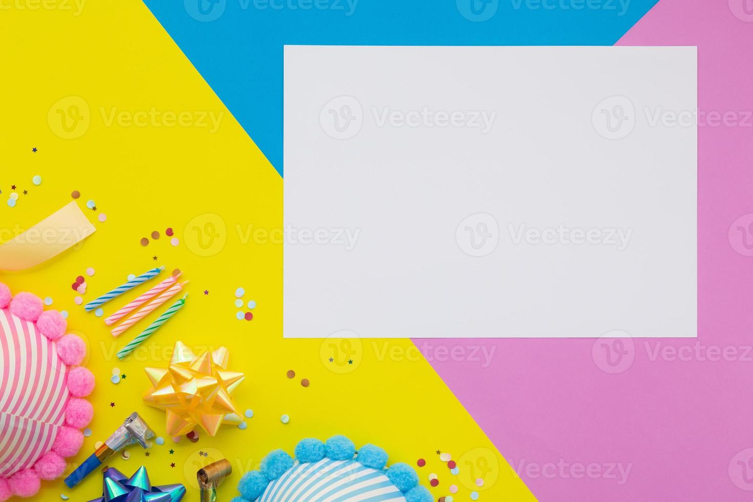 Happy birthday background, Flat lay colorful party decoration with flyer invitation card on pastel yellow, blue and pink geometric background photo