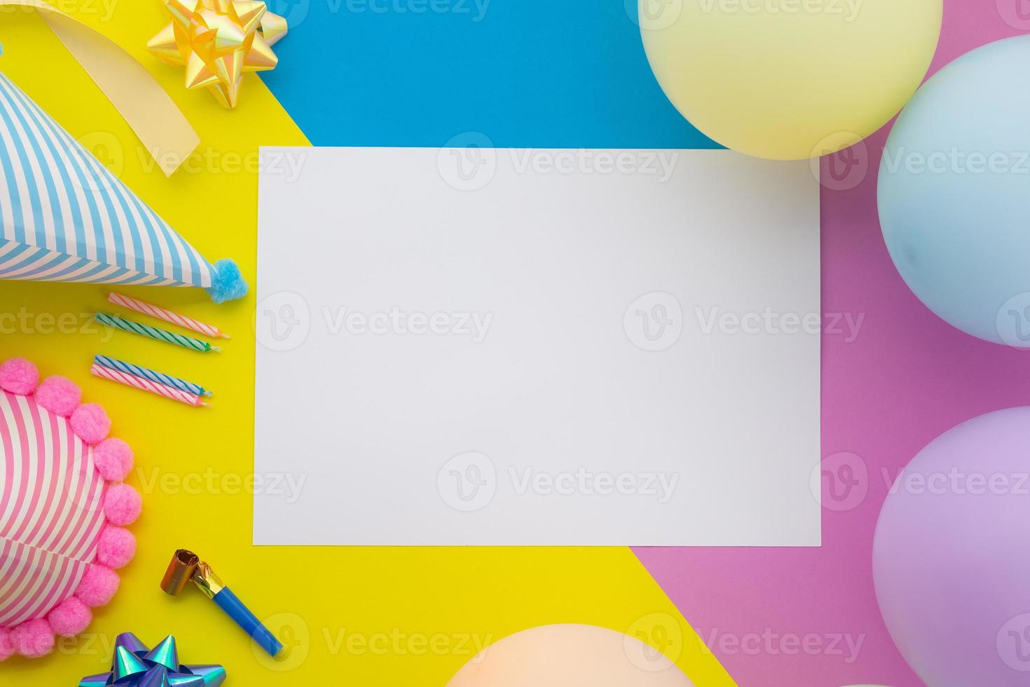 Happy birthday background, Flat lay colorful party decoration with flyer invitation card on pastel yellow, blue and pink geometric background photo