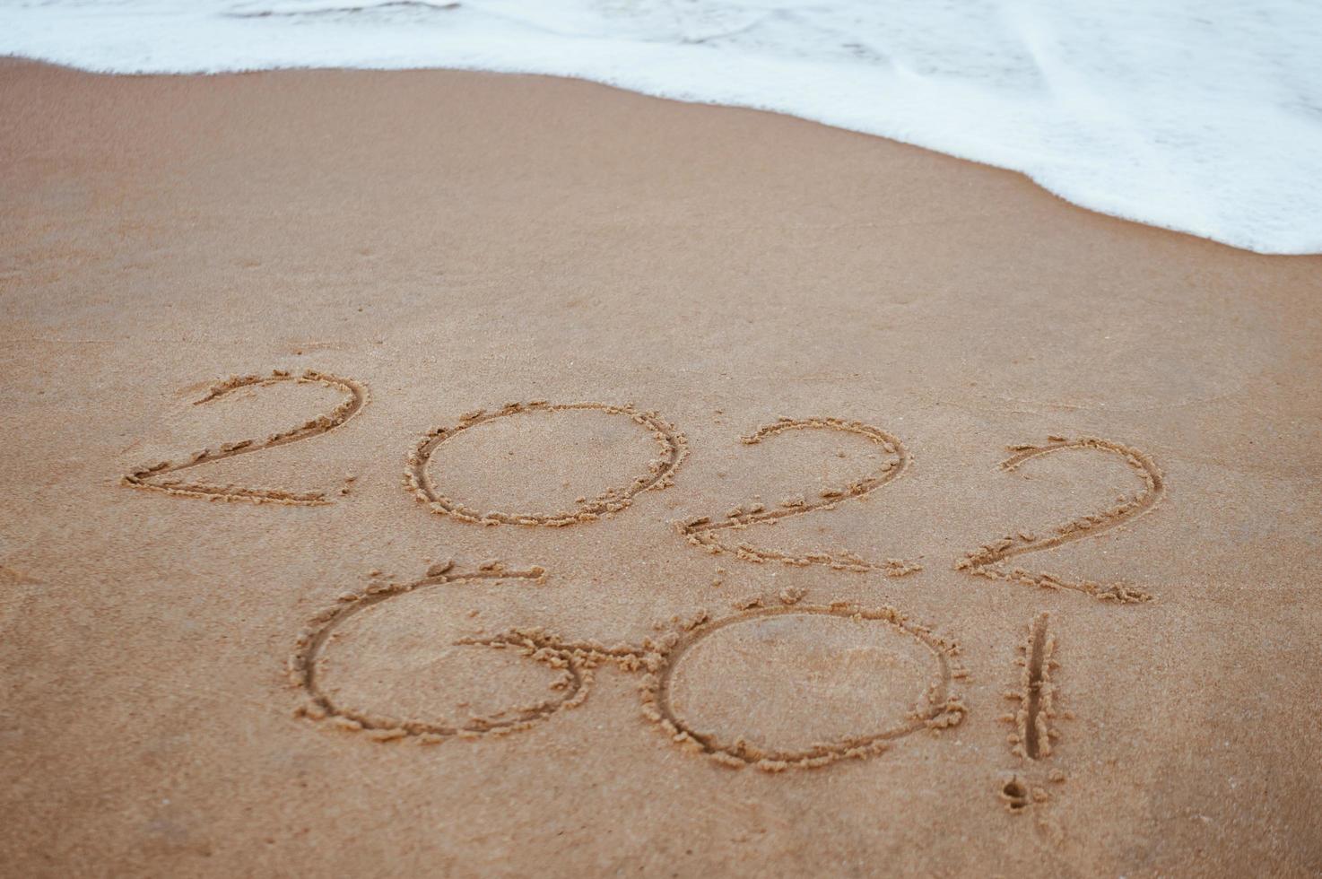 Start and go 2022 on the sand at the beach to show life ahead next year. background photo