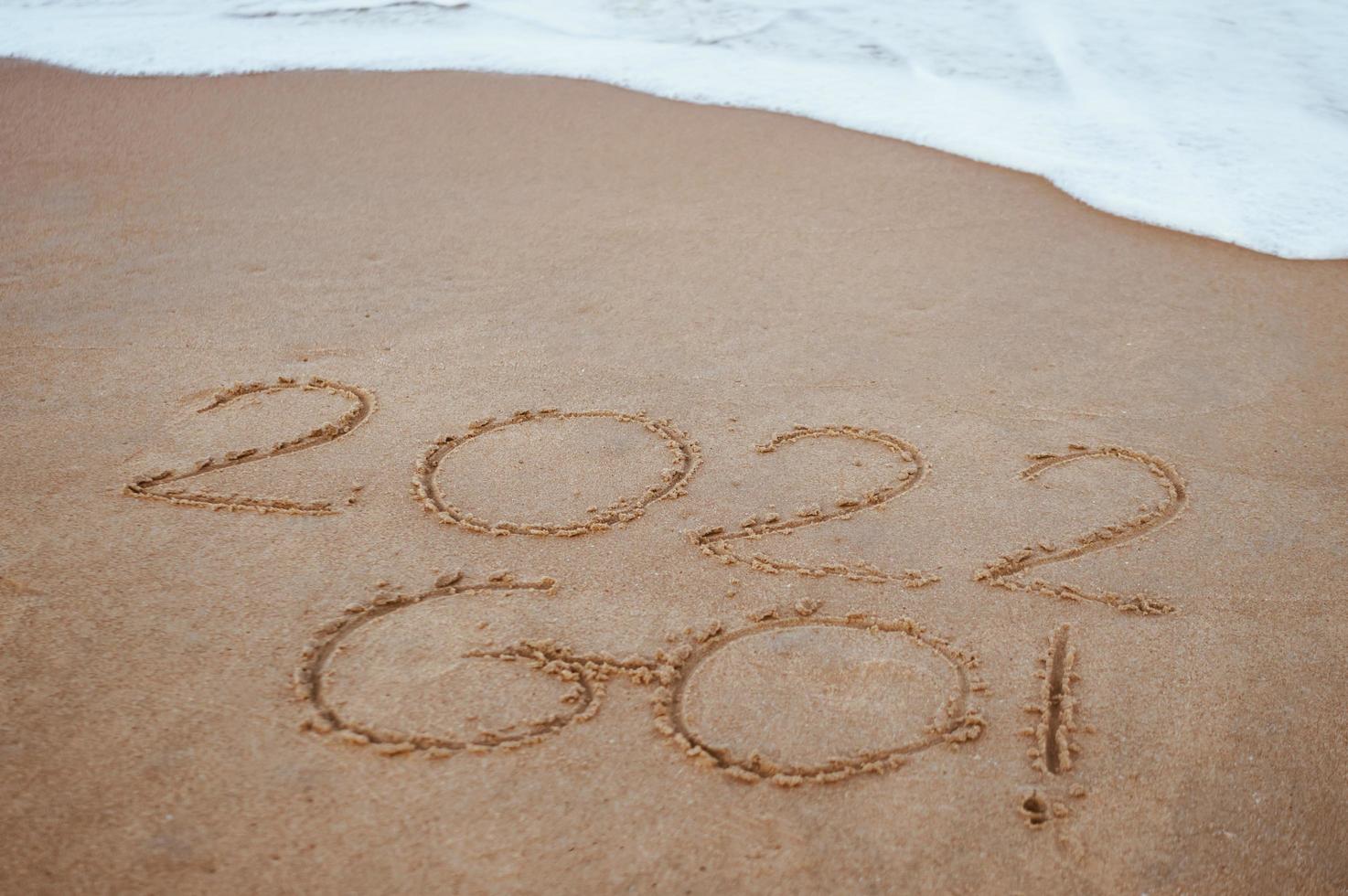 comience y vaya 2022 en la arena de la playa para mostrar la vida por delante el próximo año. antecedentes foto