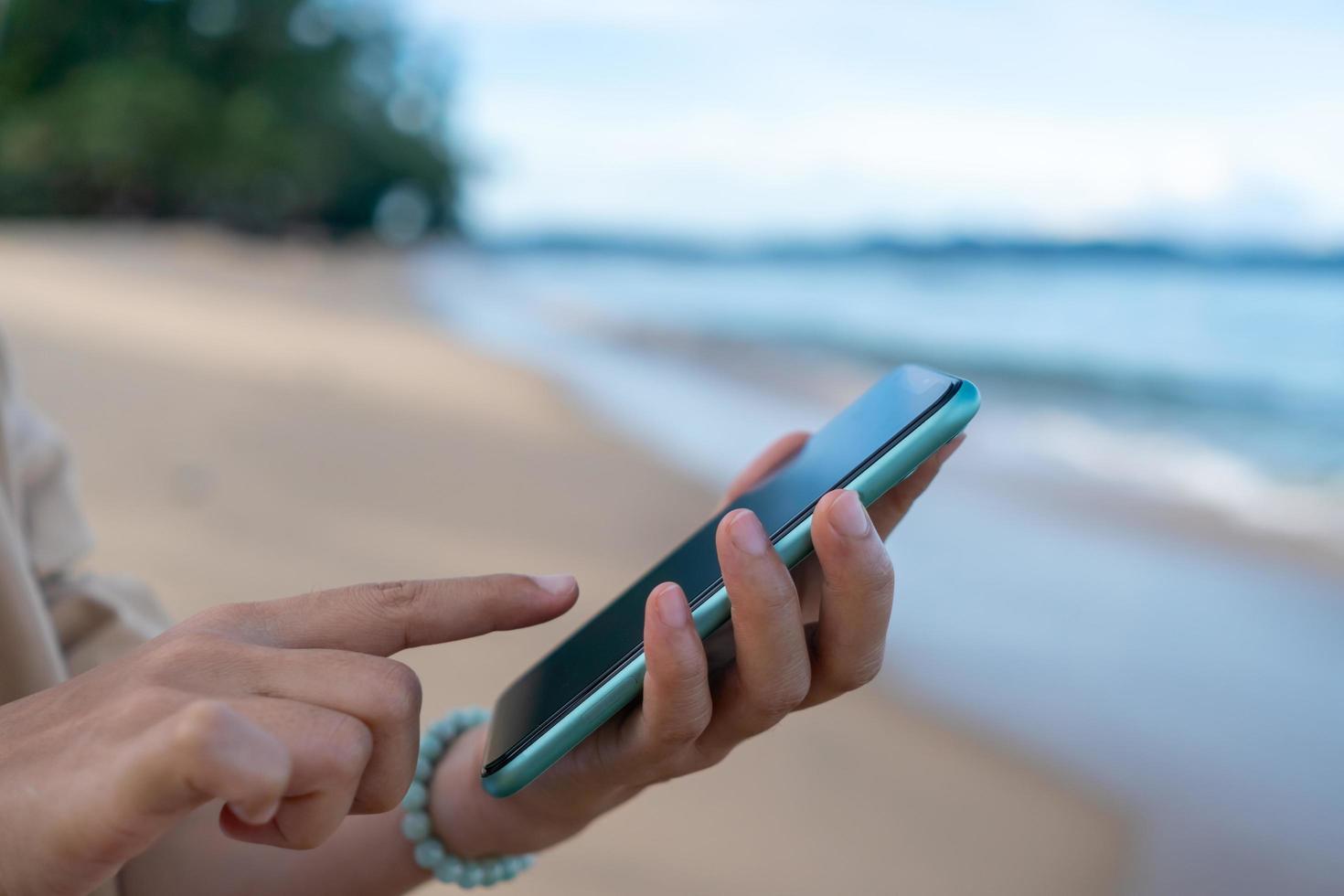 Woman hand using smartphone to do work business, social network, communication. photo