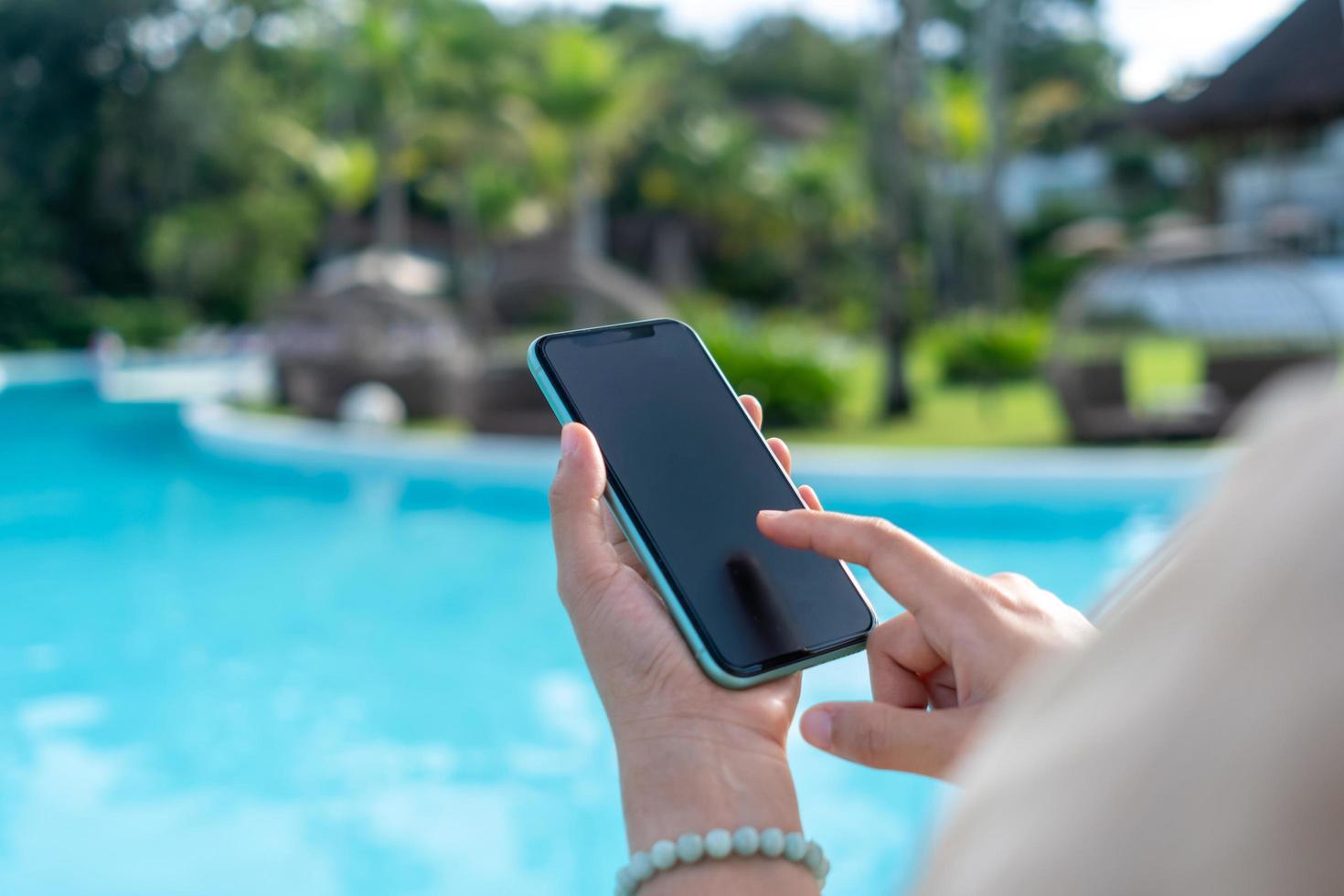 Woman hand using smartphone to do work business, social network, communication. photo