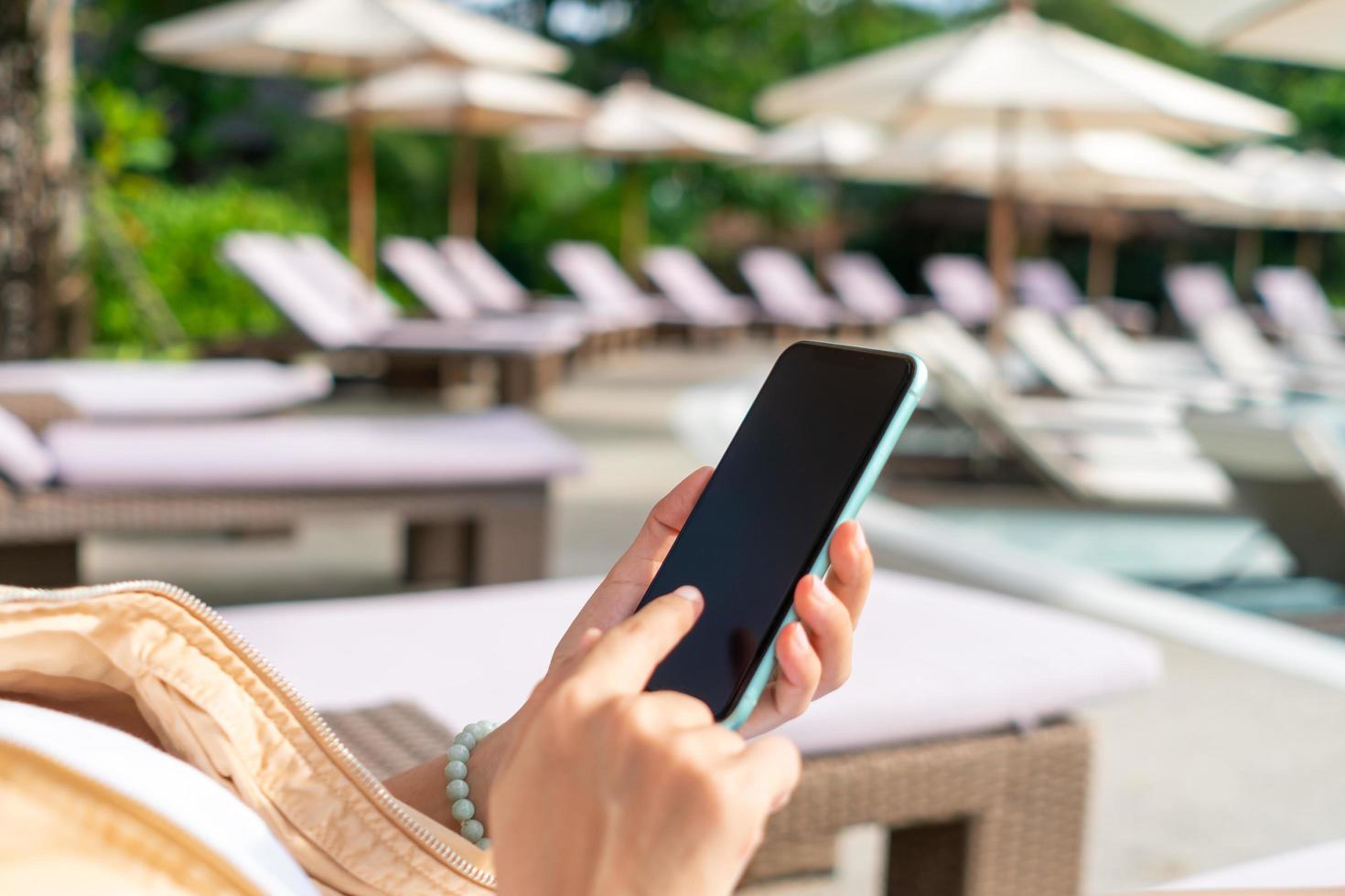 Woman hand using smartphone to do work business, social network, communication. photo