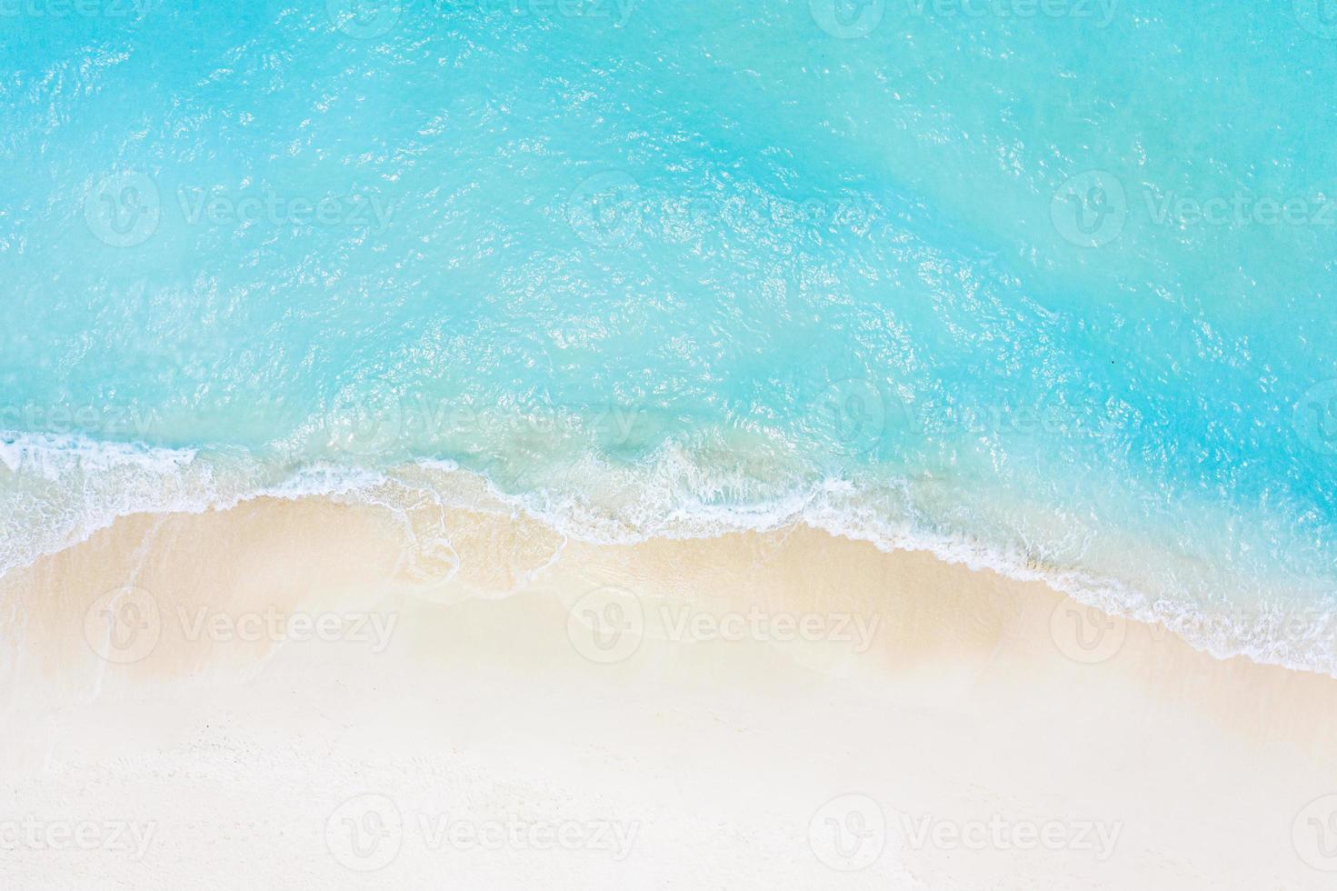 Beach and waves from top view. Turquoise water background from top view. Summer seascape from air. Top view from drone. Travel concept and idea photo