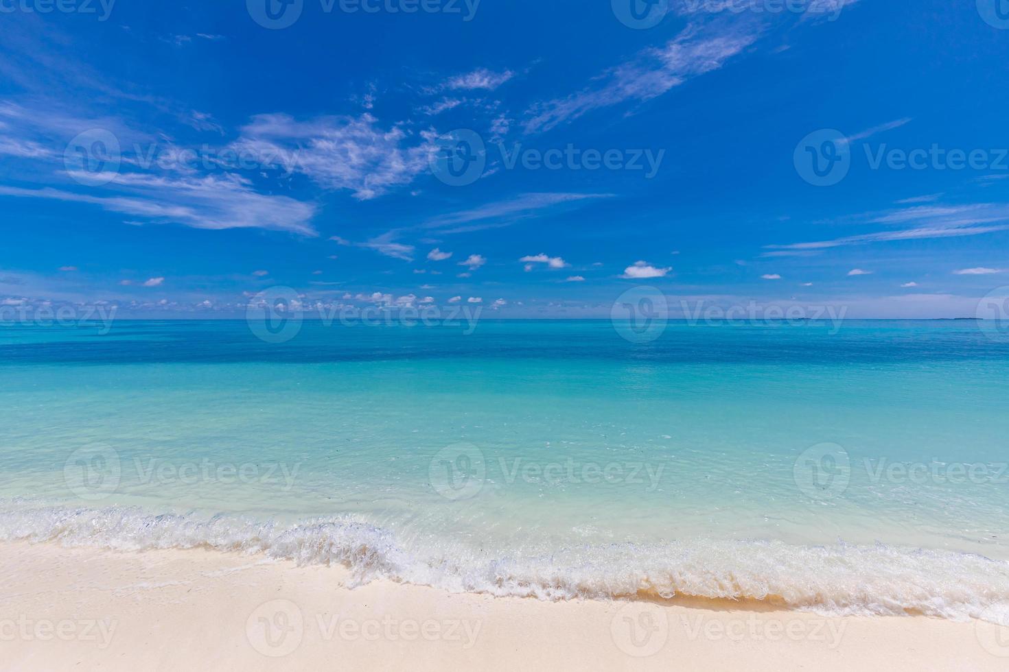Closeup of sand on beach and blue summer sky. Panoramic beach landscape. Empty tropical beach and seascape. Orange and golden sunset sky, soft sand, calmness, tranquil relaxing sunlight, summer mood photo