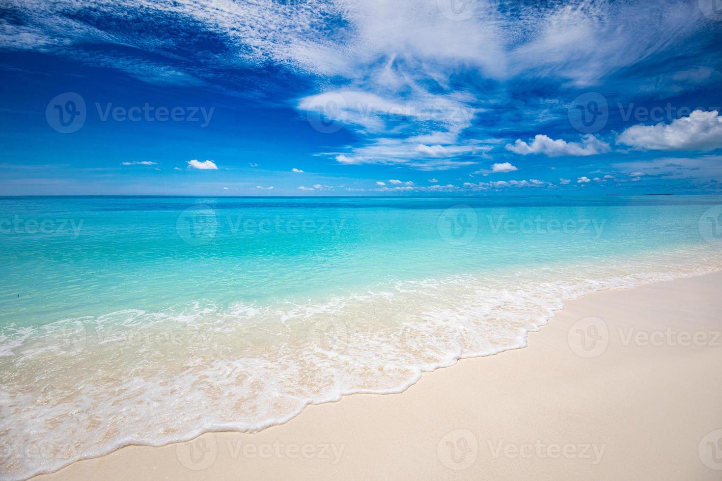 Closeup of sand on beach and blue summer sky. Panoramic beach landscape. Empty tropical beach and seascape. Orange and golden sunset sky, soft sand, calmness, tranquil relaxing sunlight, summer mood photo