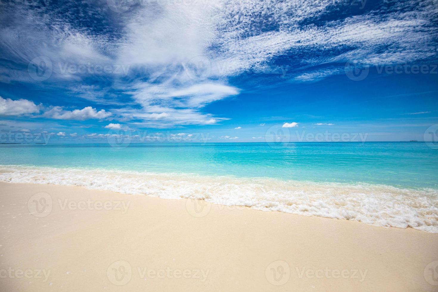 Closeup of sand on beach and blue summer sky. Panoramic beach landscape. Empty tropical beach and seascape. Orange and golden sunset sky, soft sand, calmness, tranquil relaxing sunlight, summer mood photo