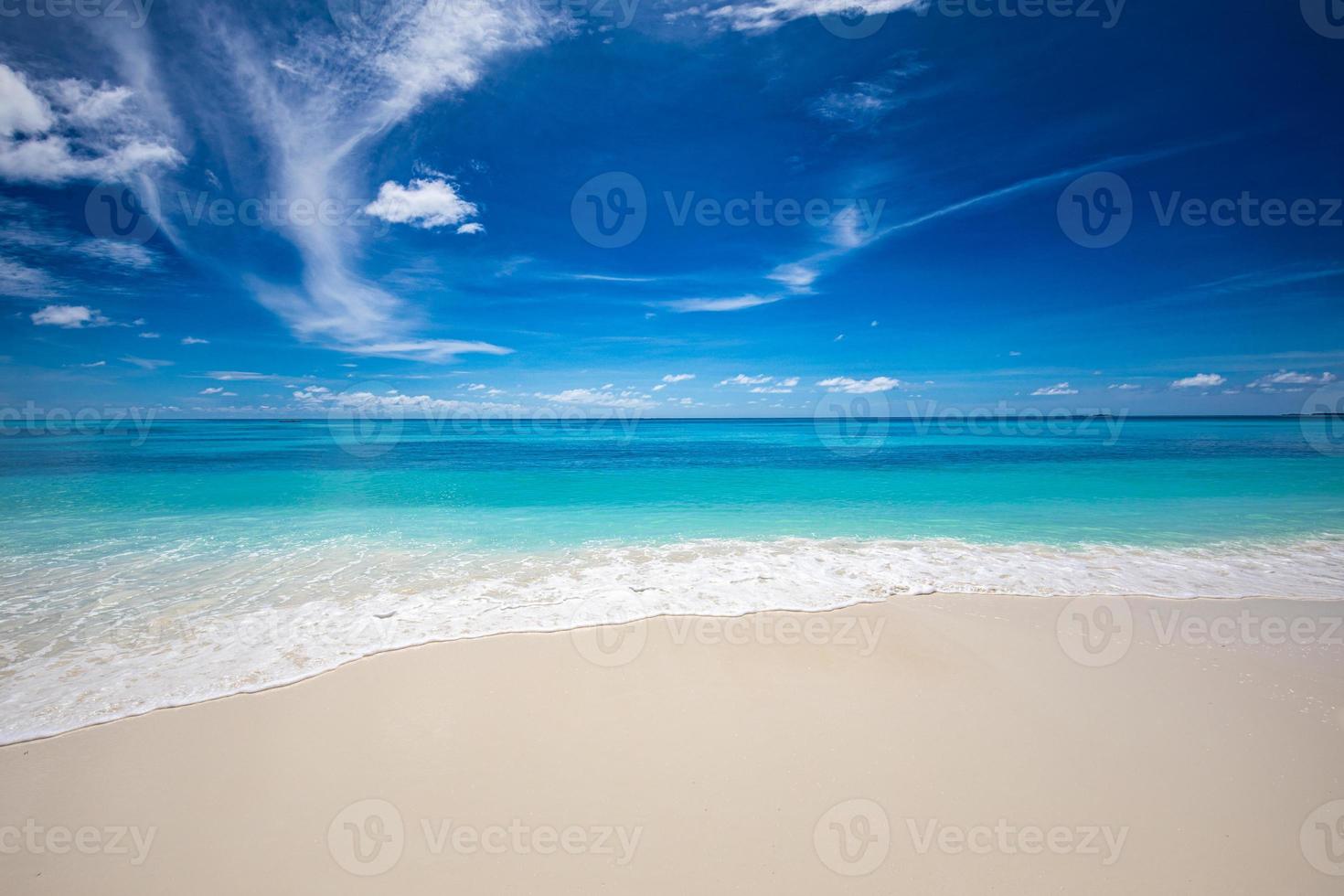 Closeup of sand on beach and blue summer sky. Panoramic beach landscape. Empty tropical beach and seascape. Orange and golden sunset sky, soft sand, calmness, tranquil relaxing sunlight, summer mood photo