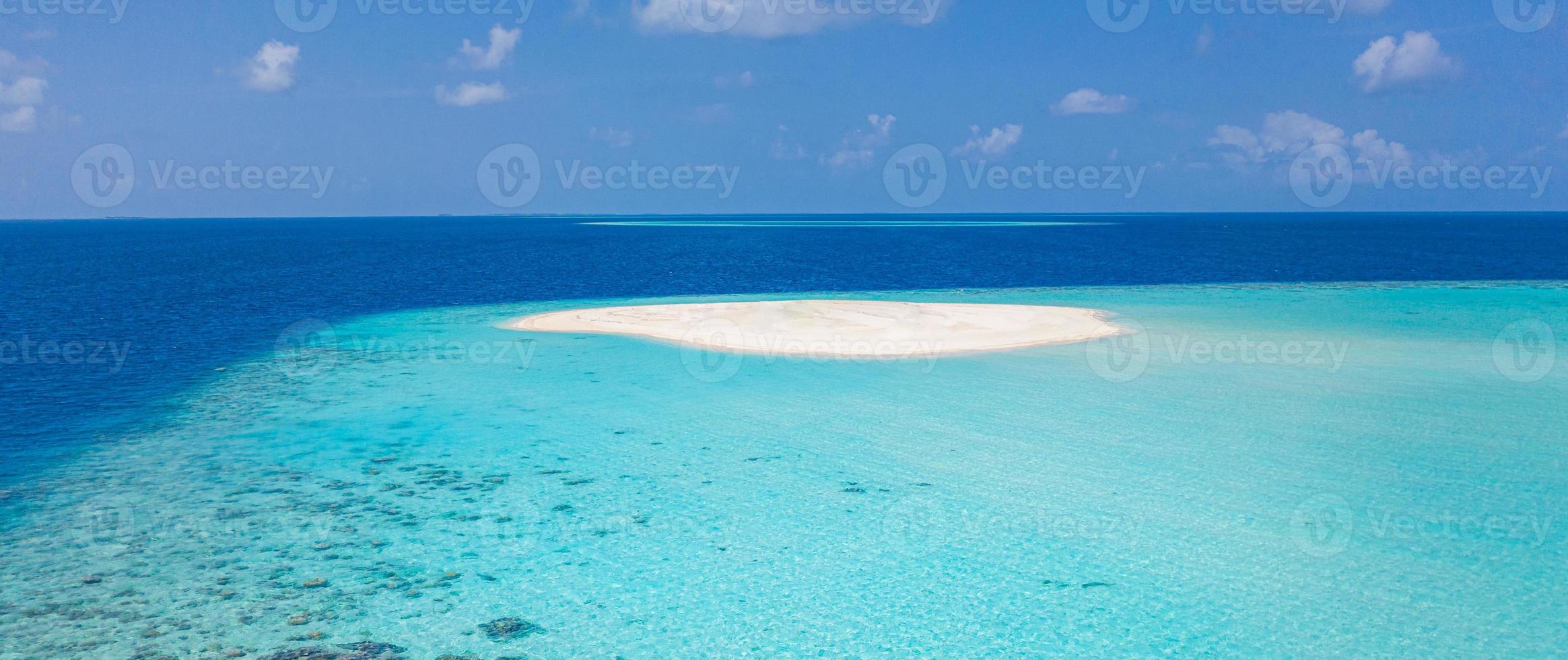 Maldivian sandbank in Indian ocean, white sandy coast with crystal azure color water, perfect getaway for tropical vacations photo