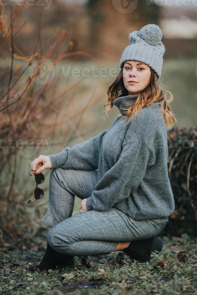 Girl posing outside during cold weather photo