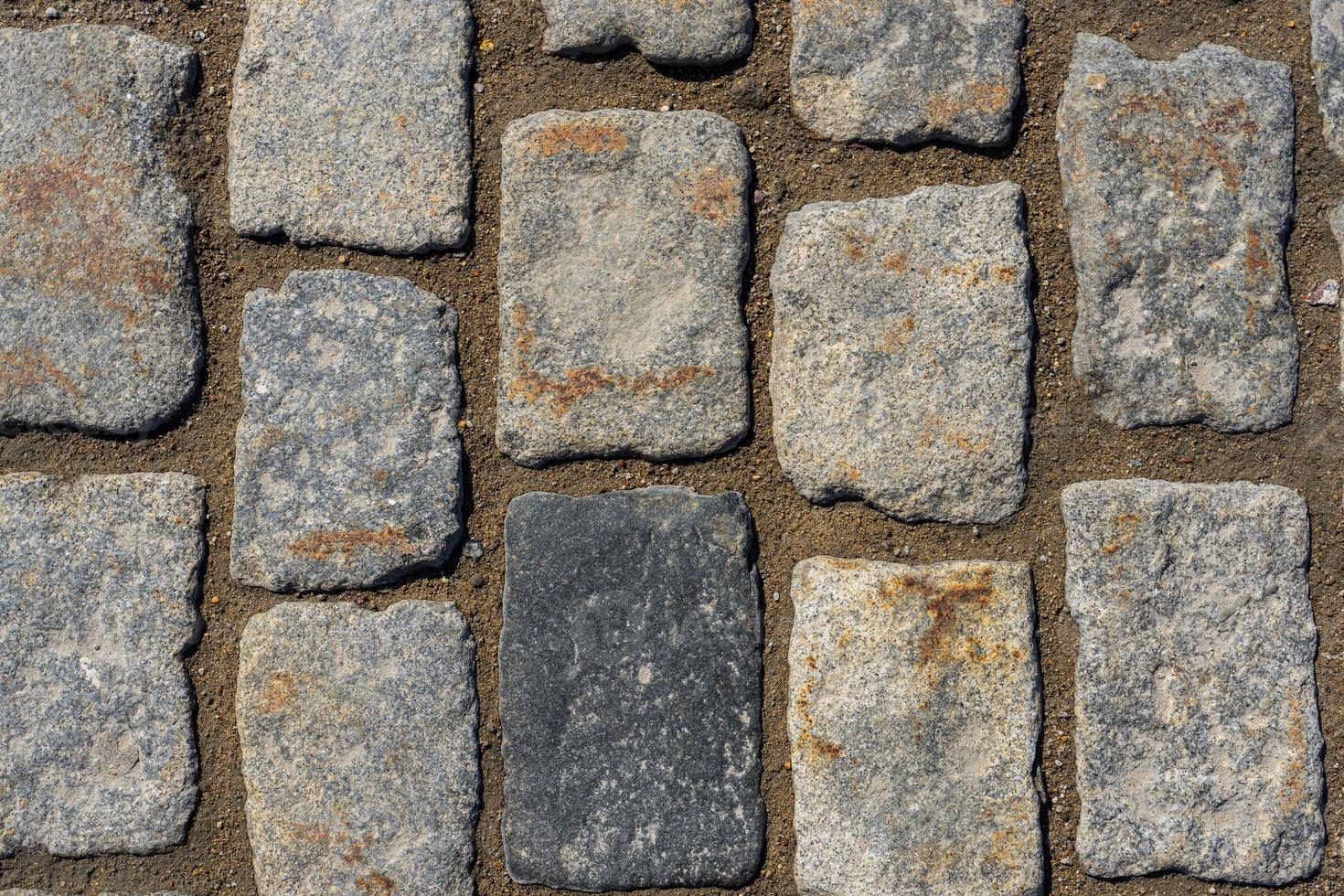 Background of granite cobblestone pavement. photo