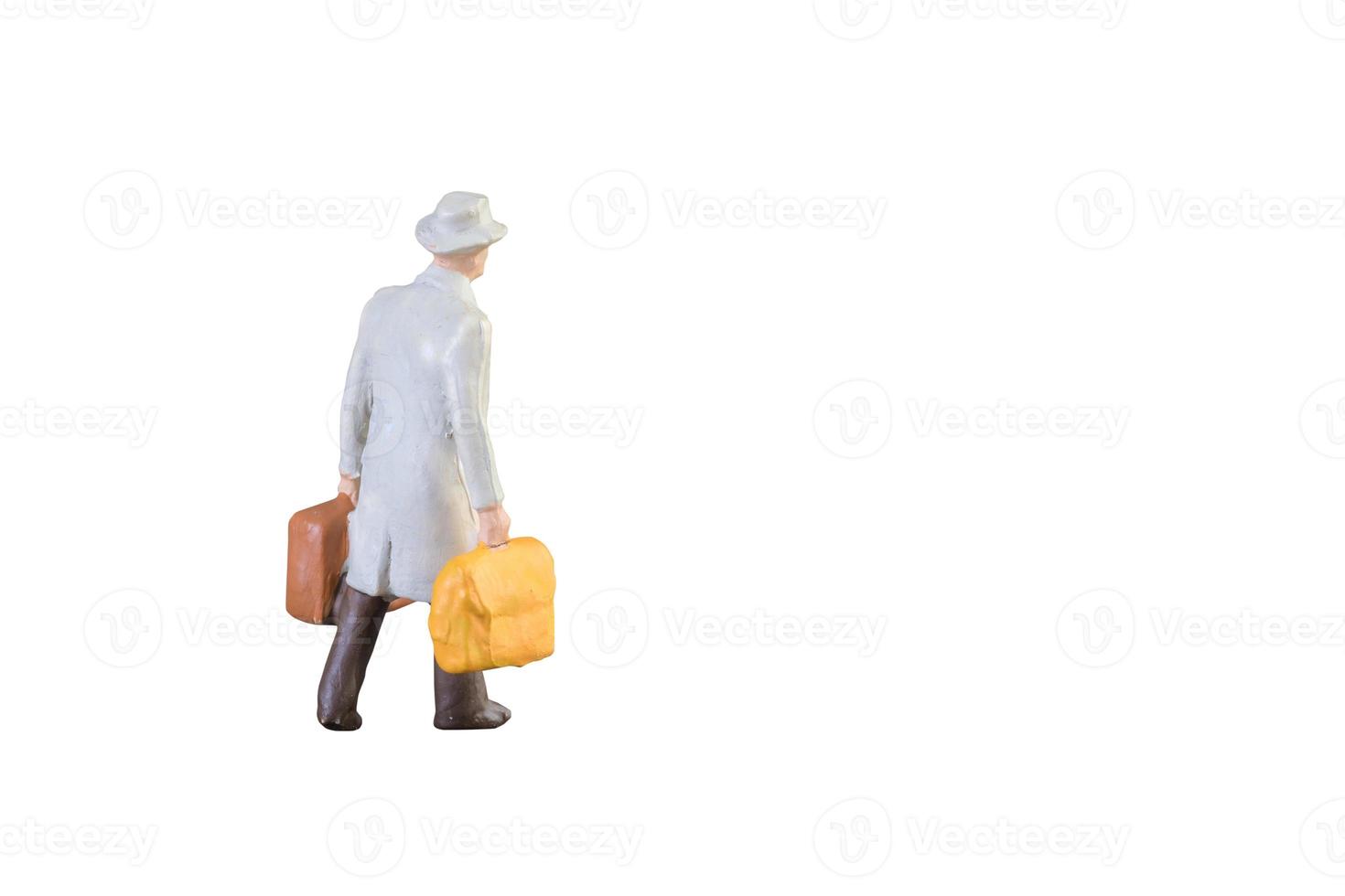 Close up of Miniature businessman and tourist people isolated with clipping path on white background.Elegant Design with copy space for placement your text, mock up for business and travel concept. photo