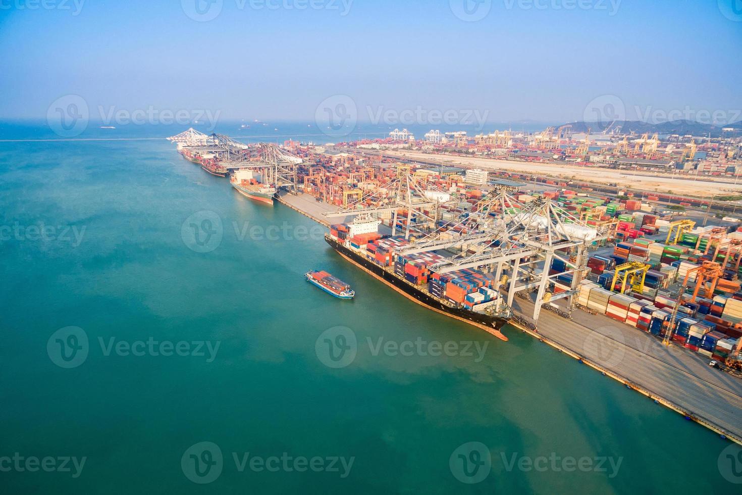 Large container shipping boat at shipping yard main transportation of cargo container  shipping. Photo concept for Global business shipping,Logistic,Import and Export industry.