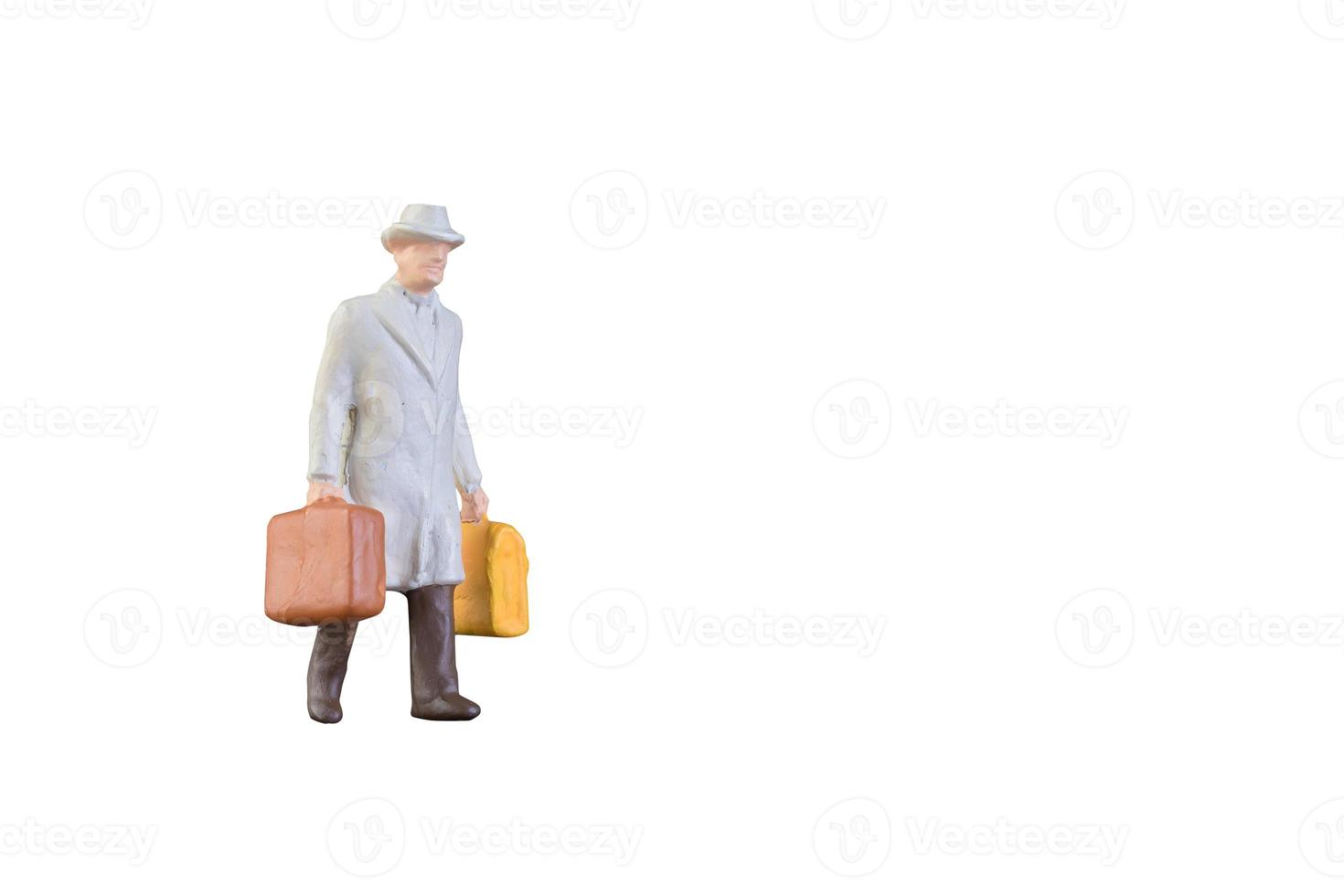 Close up of Miniature businessman and tourist people isolated with clipping path on white background.Elegant Design with copy space for placement your text, mock up for business and travel concept photo