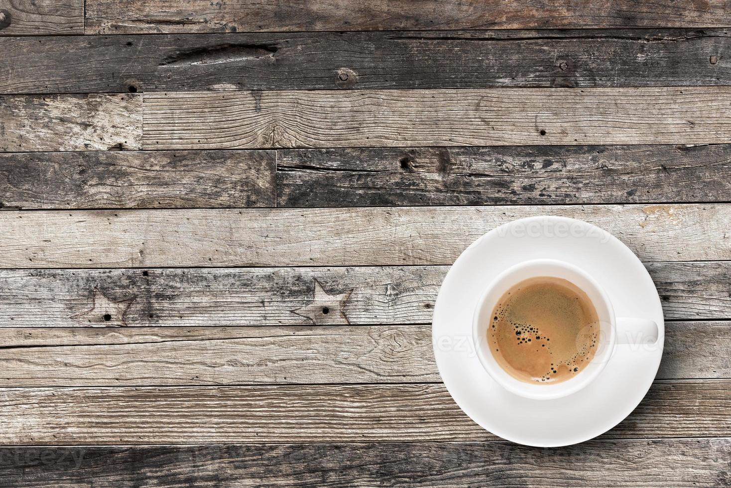 Flat lay Espresso coffee in coffee cup with copy-space on wooden table background. photo