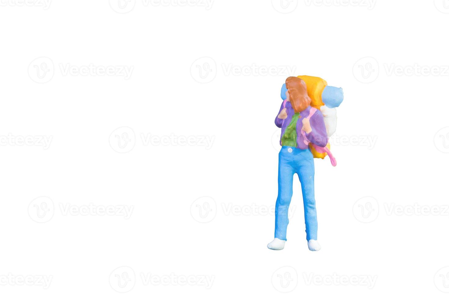 Close up of Miniature backpacker and tourist people isolated with clipping paht on white background.Elegant Design with copy space for placement your text, mock up for travel concept photo