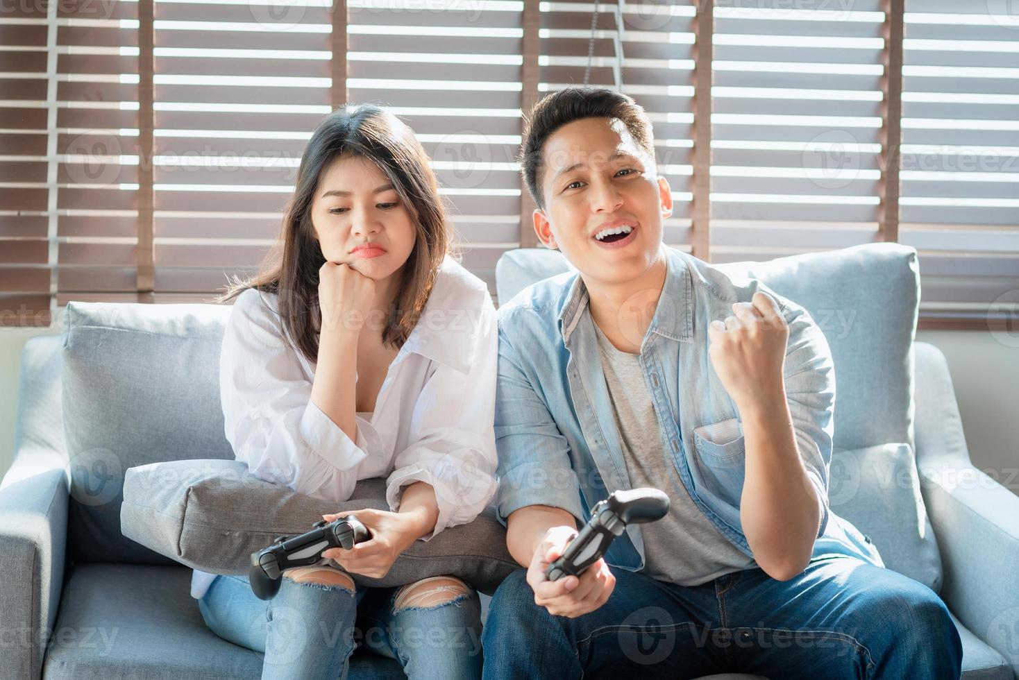 Asian couple lovers enjoy and play console game on vacation make more quality time of happiness together at home photo
