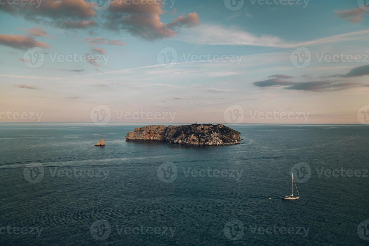 view of an island of the coast of the sea photo