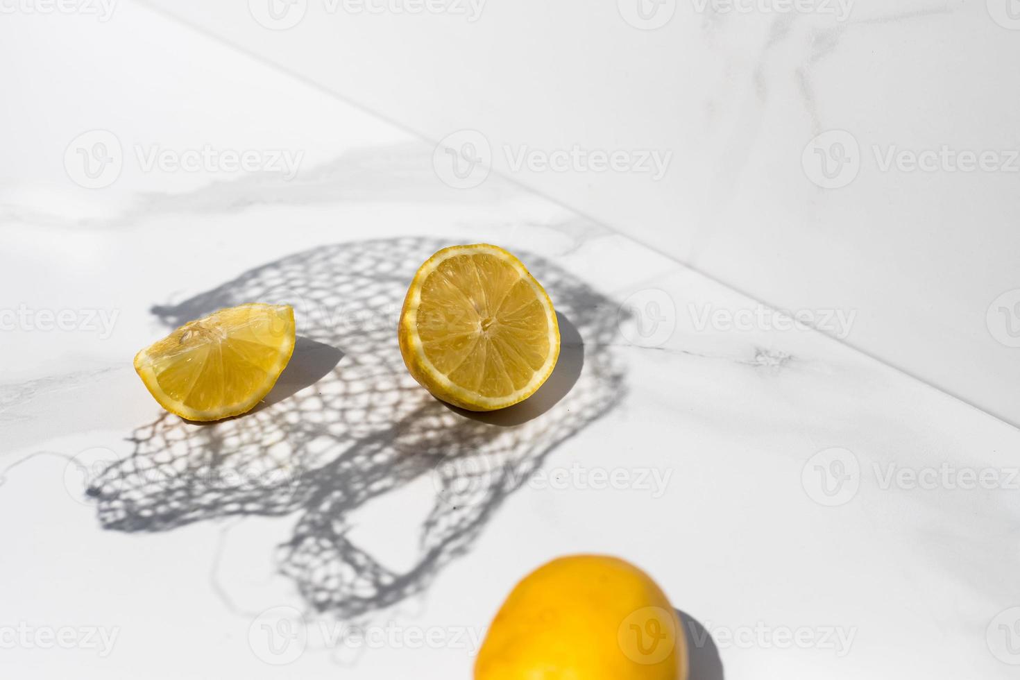 lemon on a white background with a net shadow photo