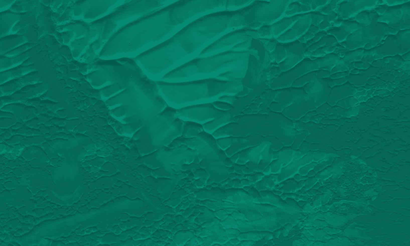 An abstract acrylic painting background with pine green color photo