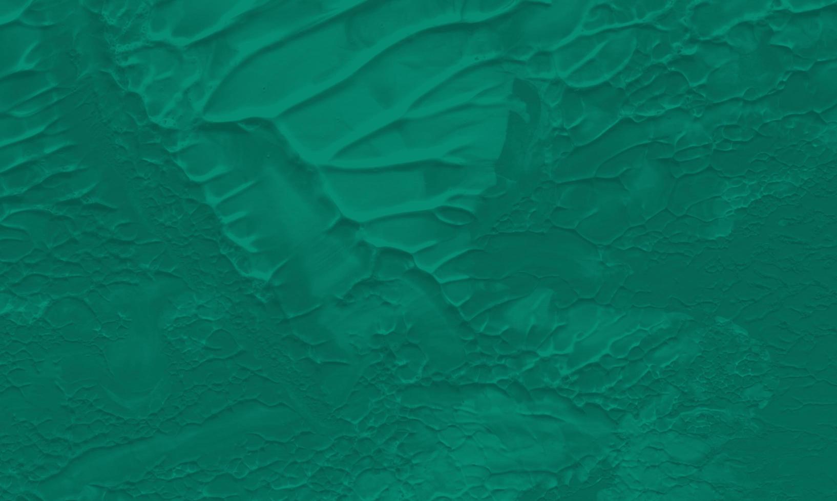 An abstract acrylic painting background with pine green color photo