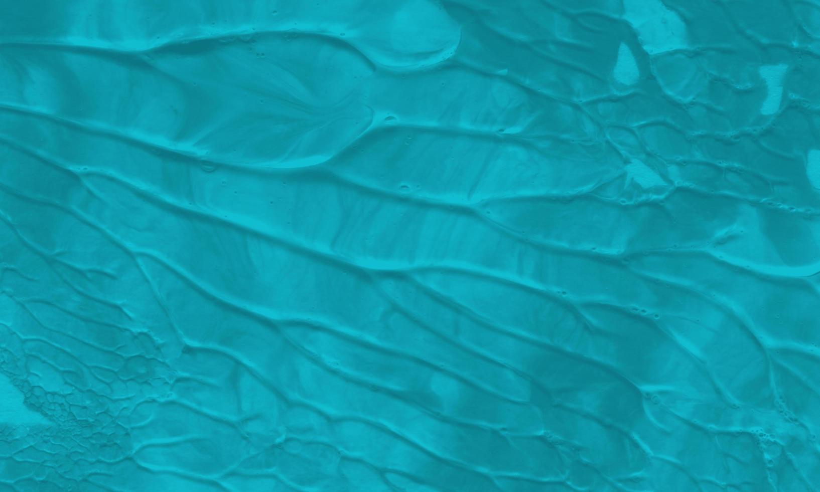 An abstract acrylic painting background with turquoise color photo