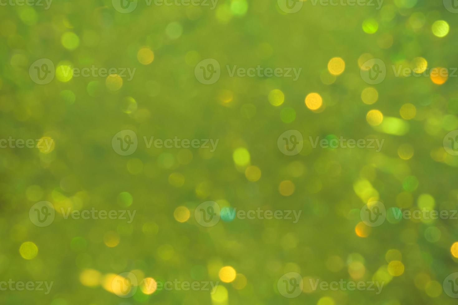 Unfocused blur of light green smoky lights-abstract blue background photo