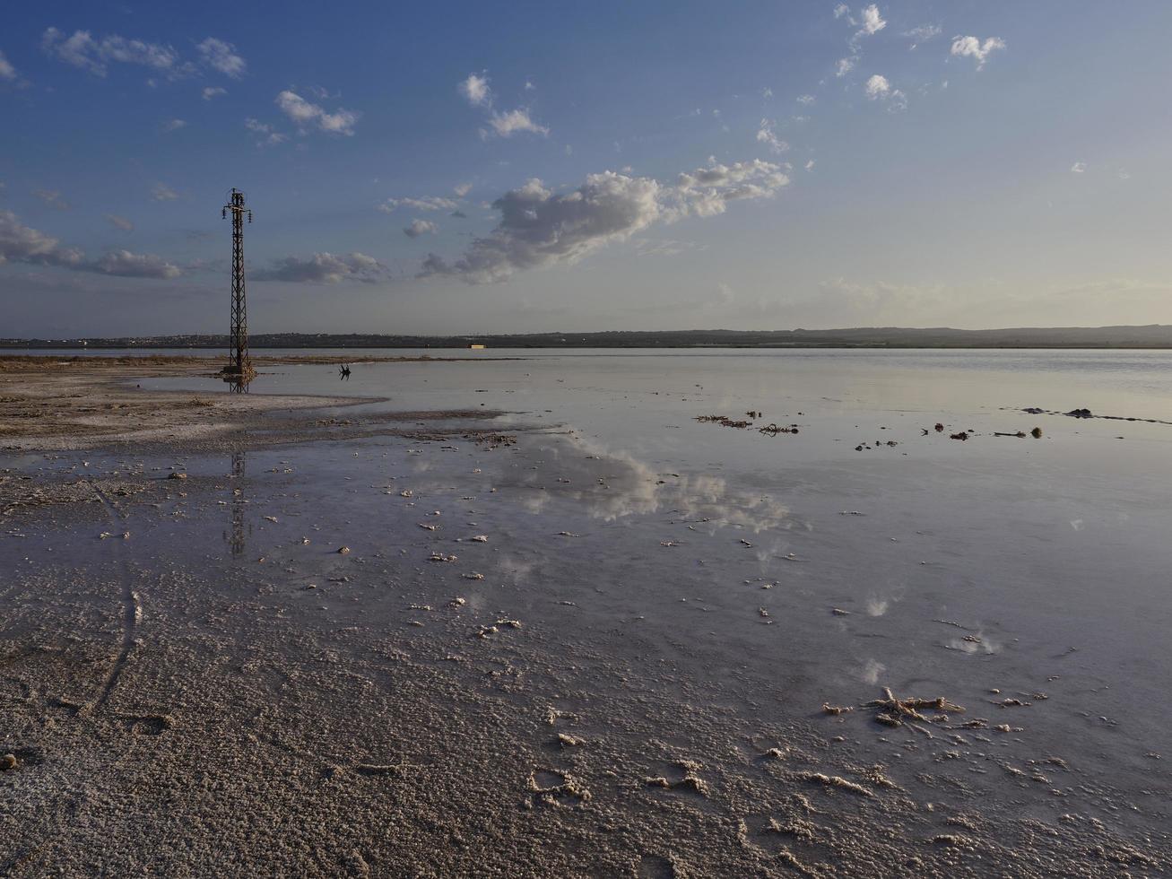 Sunset on the pink lagoon of the salt flats of Torrevieja, Spain photo