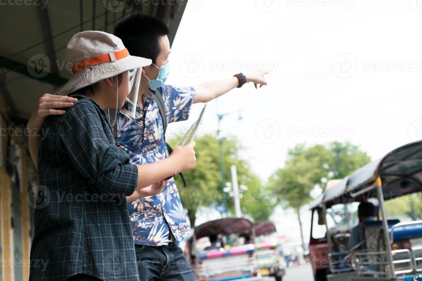 Father and son wearing health masks  travel at Asia.  New normal concept photo