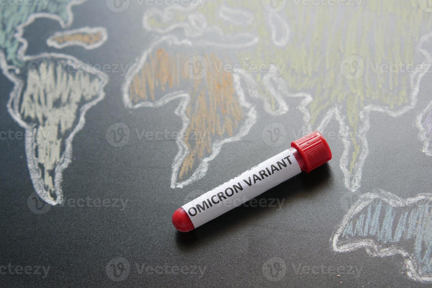 omicron variant corona virus blood test tube and world map photo