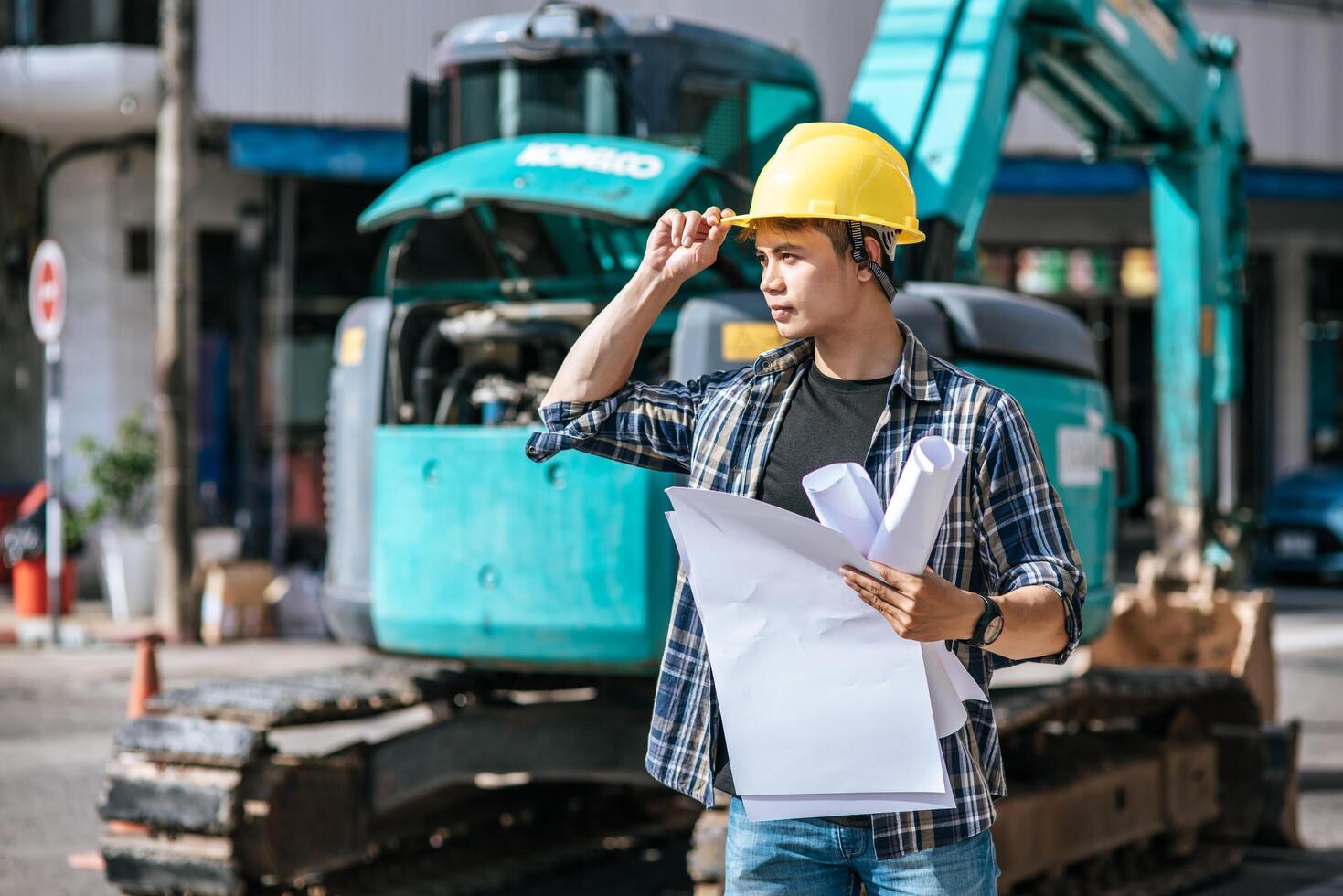 Civil engineers work on large road and machinery conditions. photo