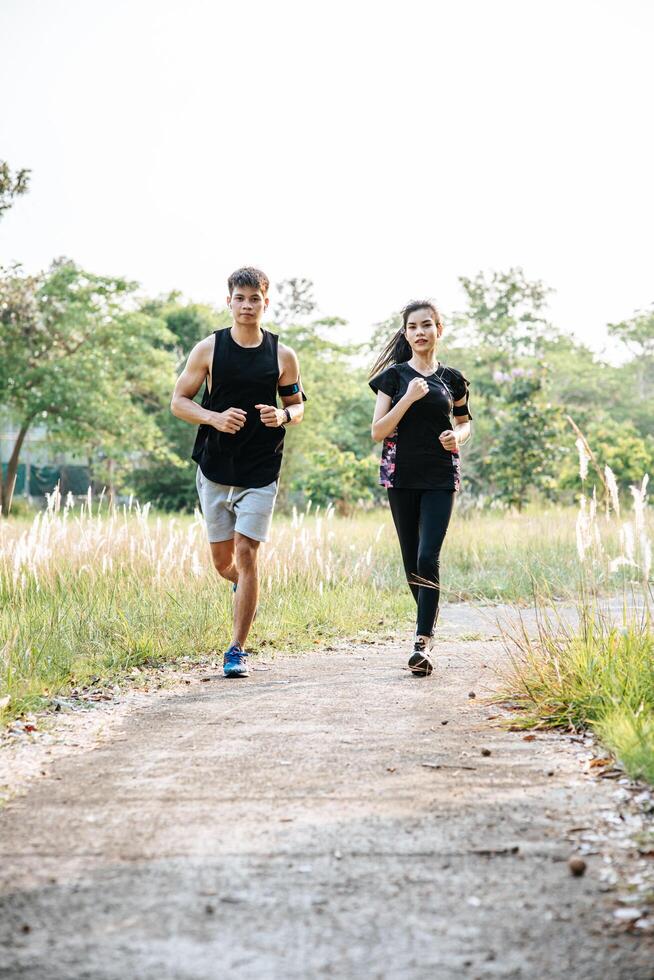 Men and women exercise by running. photo