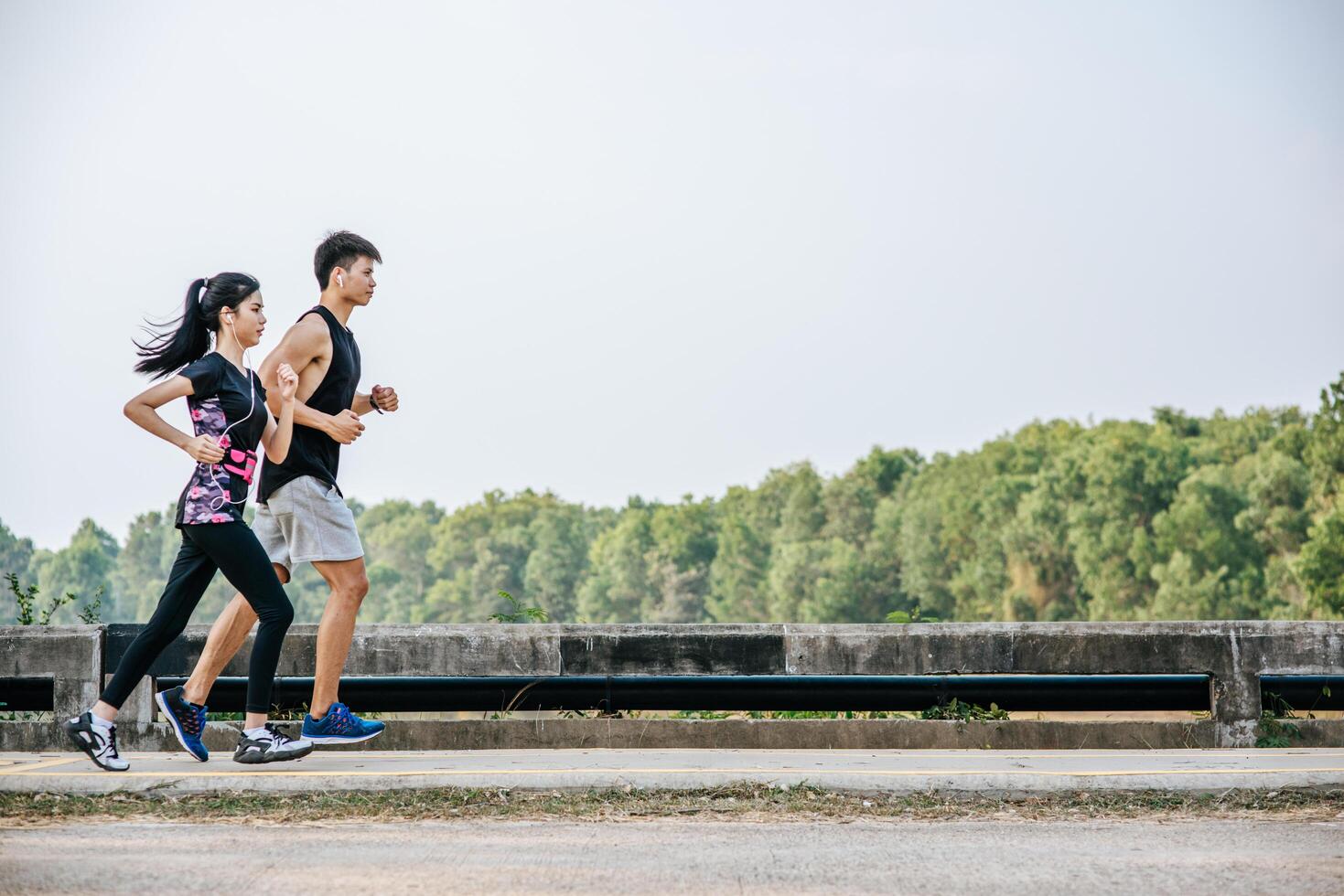 Men and women exercise by running. photo