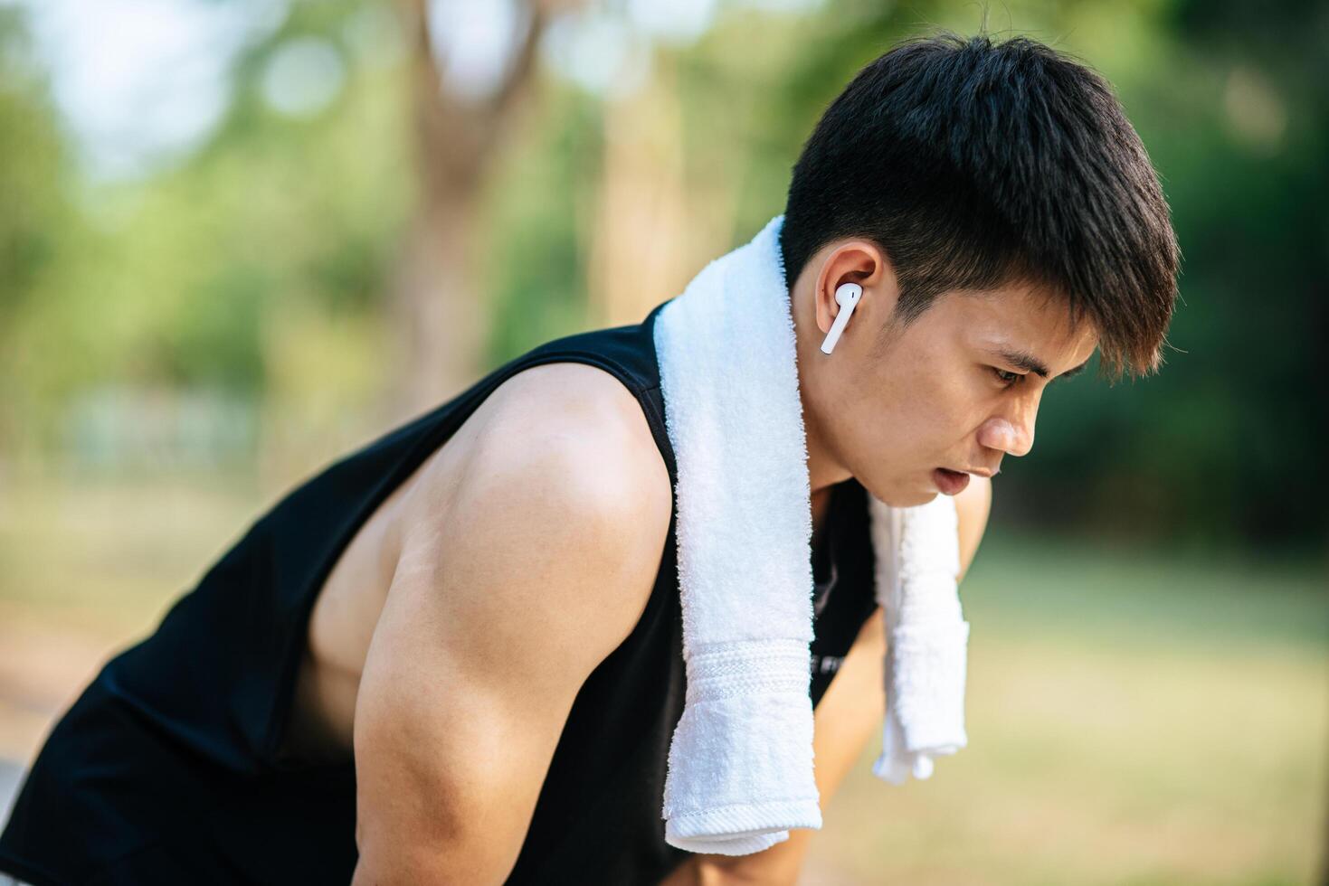 Men stand and bow and rest after exercising on the roadside. photo