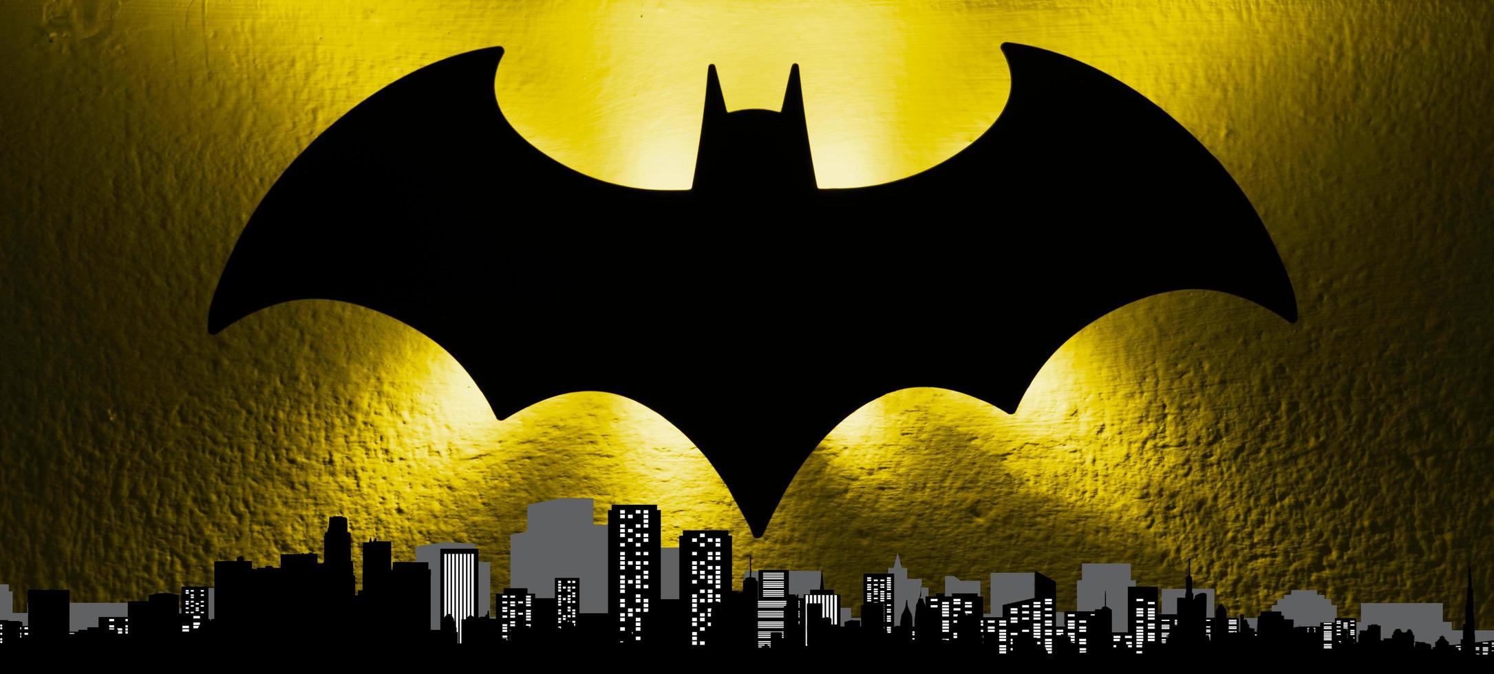 Bologna, Italy, 2017 - The bat signal light from the Gotham cityscape to celebrate the Batmans birthday. Batman day concept. photo