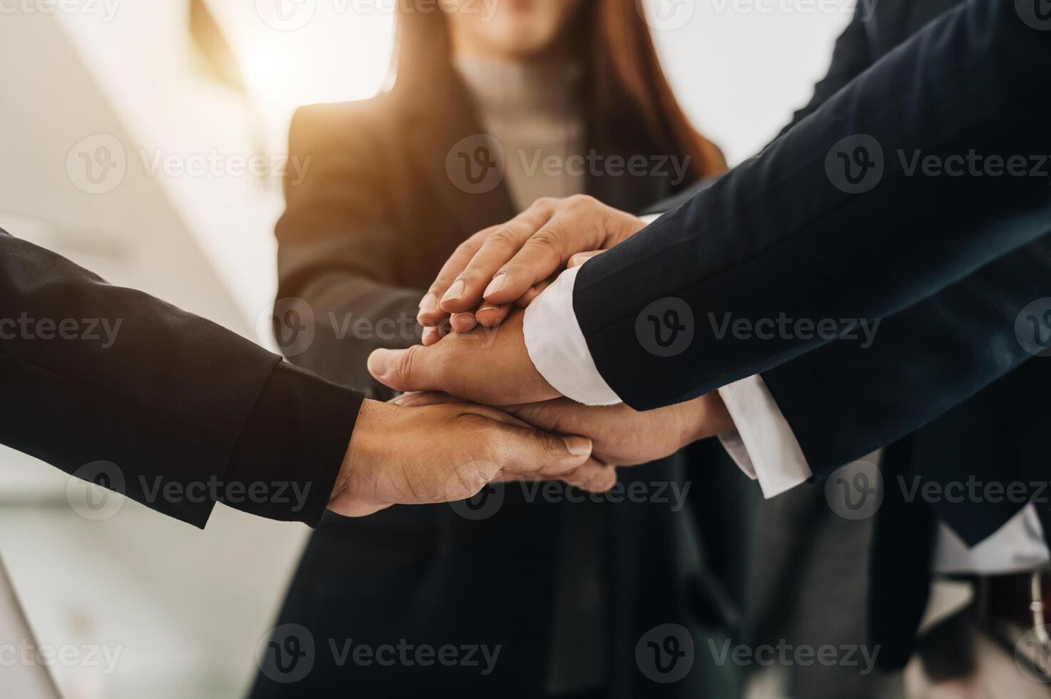 Close up on hands of business people join together their hands together on unity concept photo