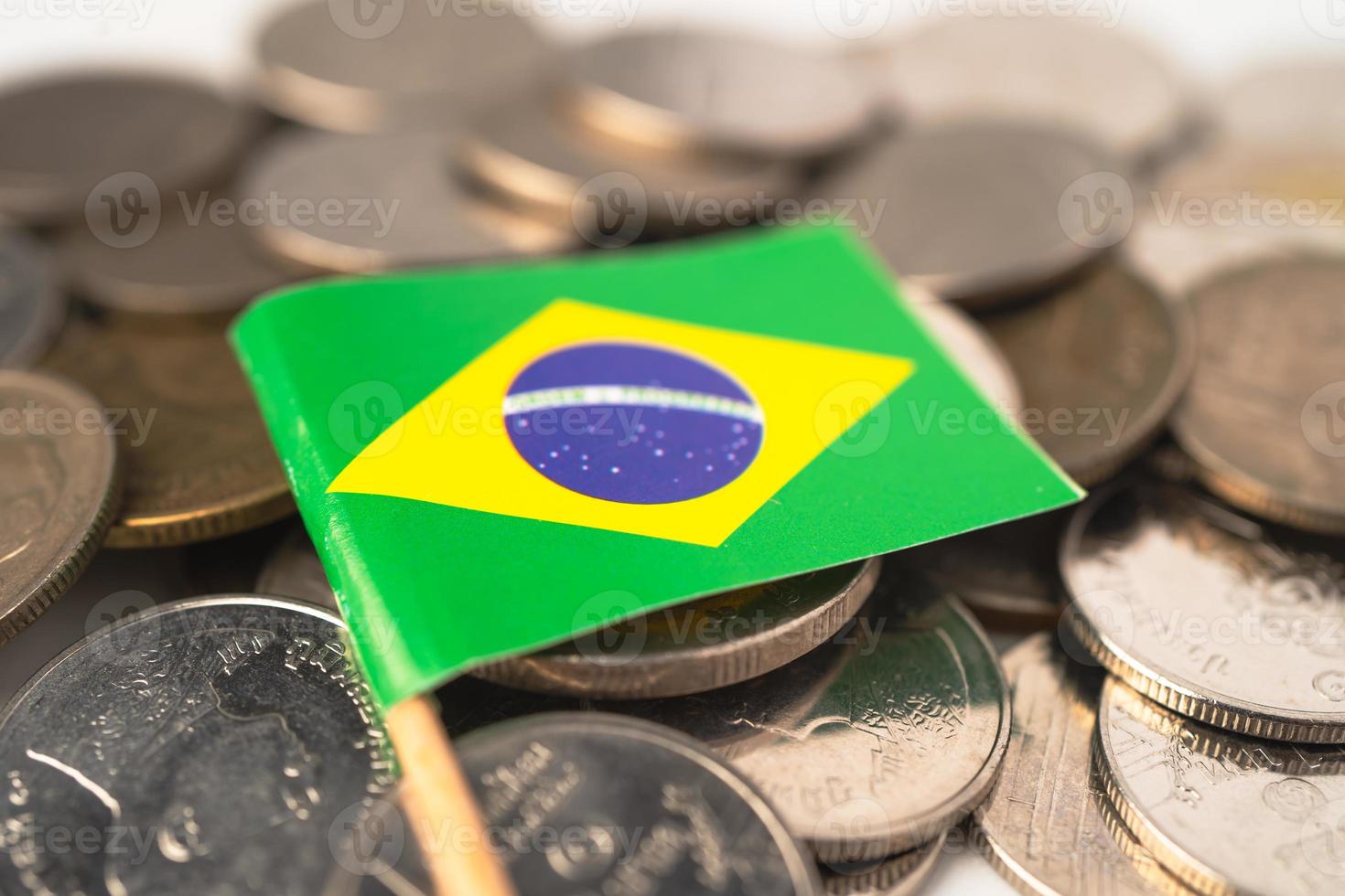 Brazil Flag on coins background, Business and finance concept. photo